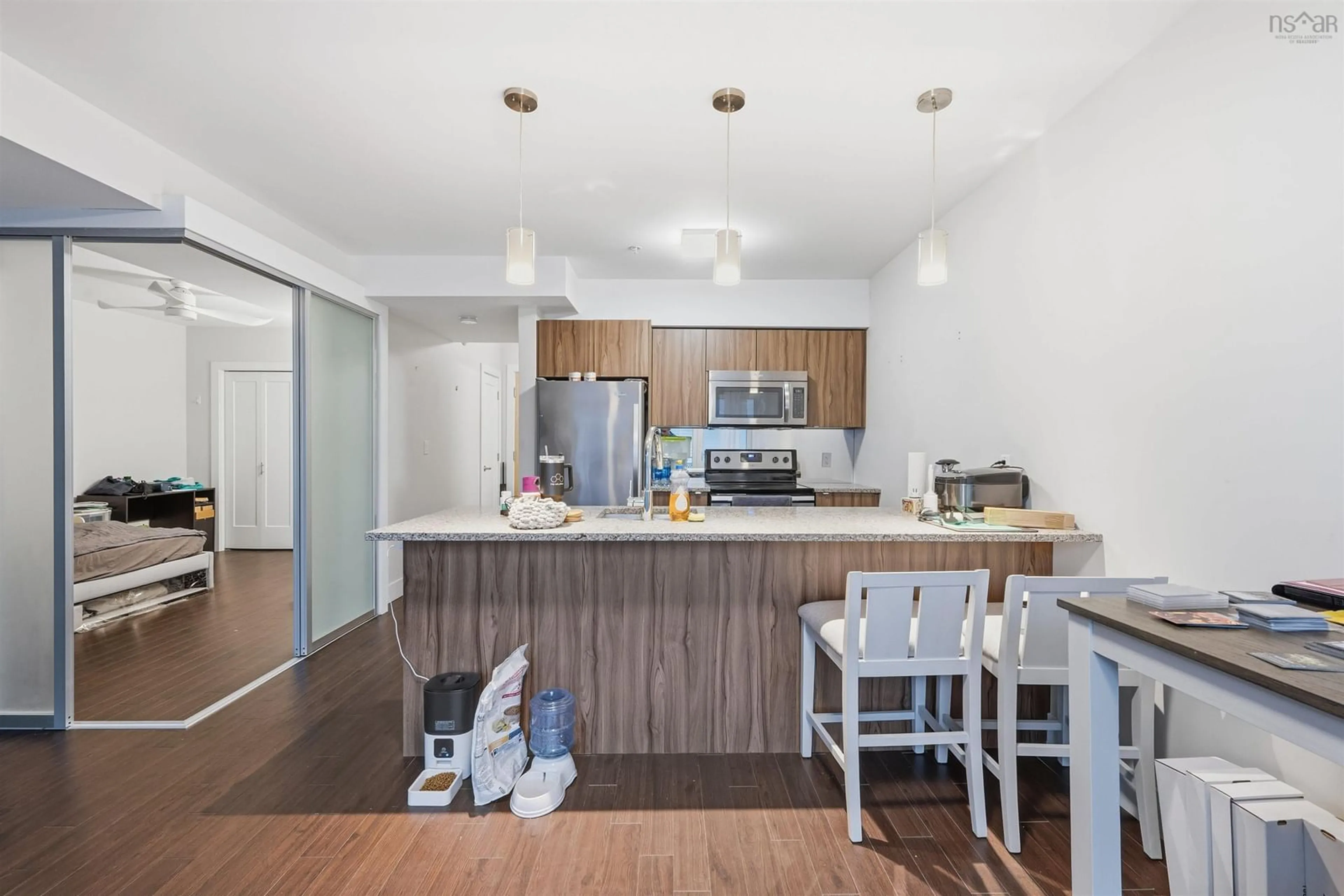 Open concept kitchen, wood/laminate floor for 5677 Harris St #206, Halifax Nova Scotia B3K 0G4
