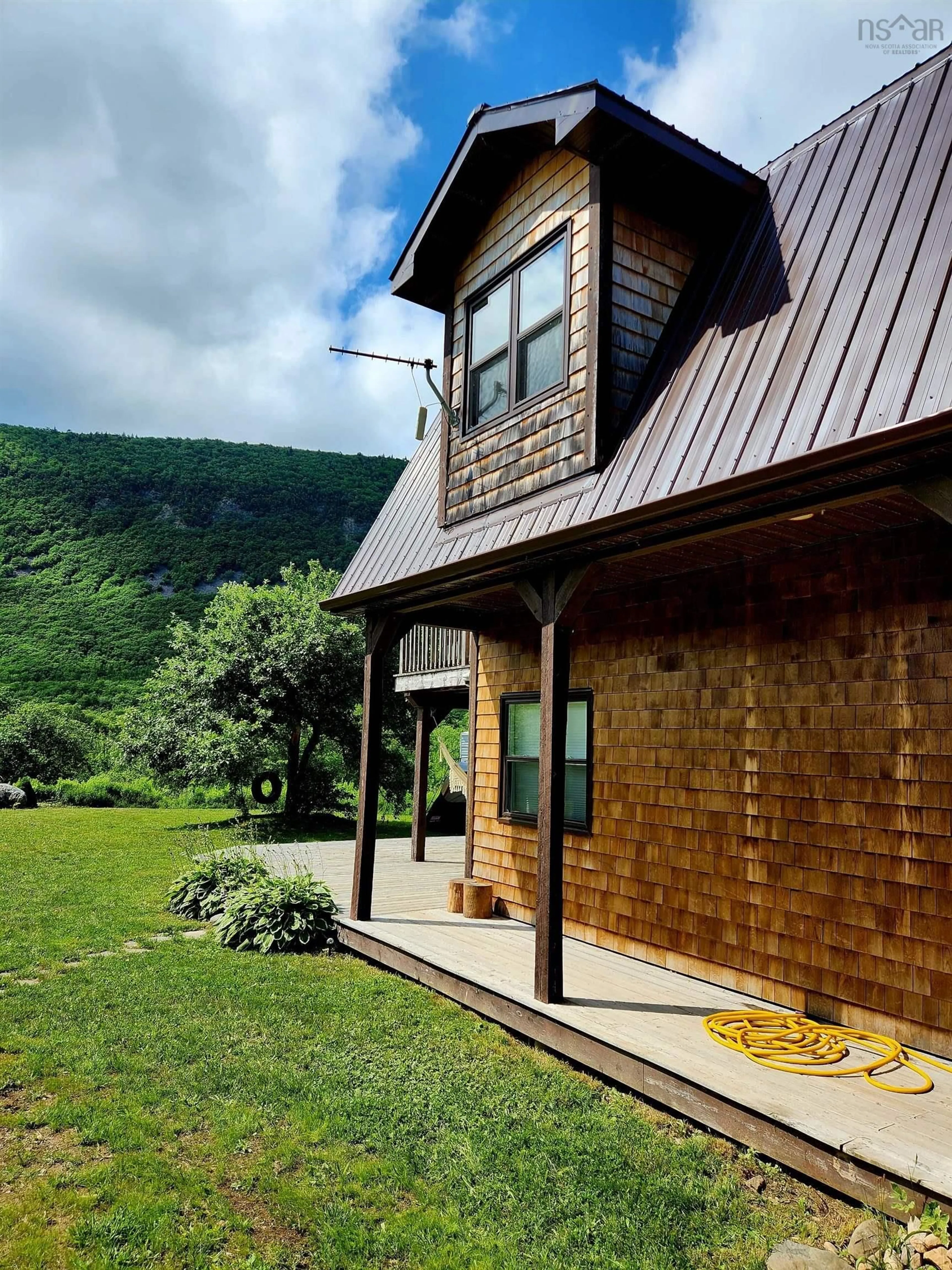 Home with vinyl exterior material, mountain view for 27859 Cabot Trail Rd, Dingwall Nova Scotia B0C 1G0