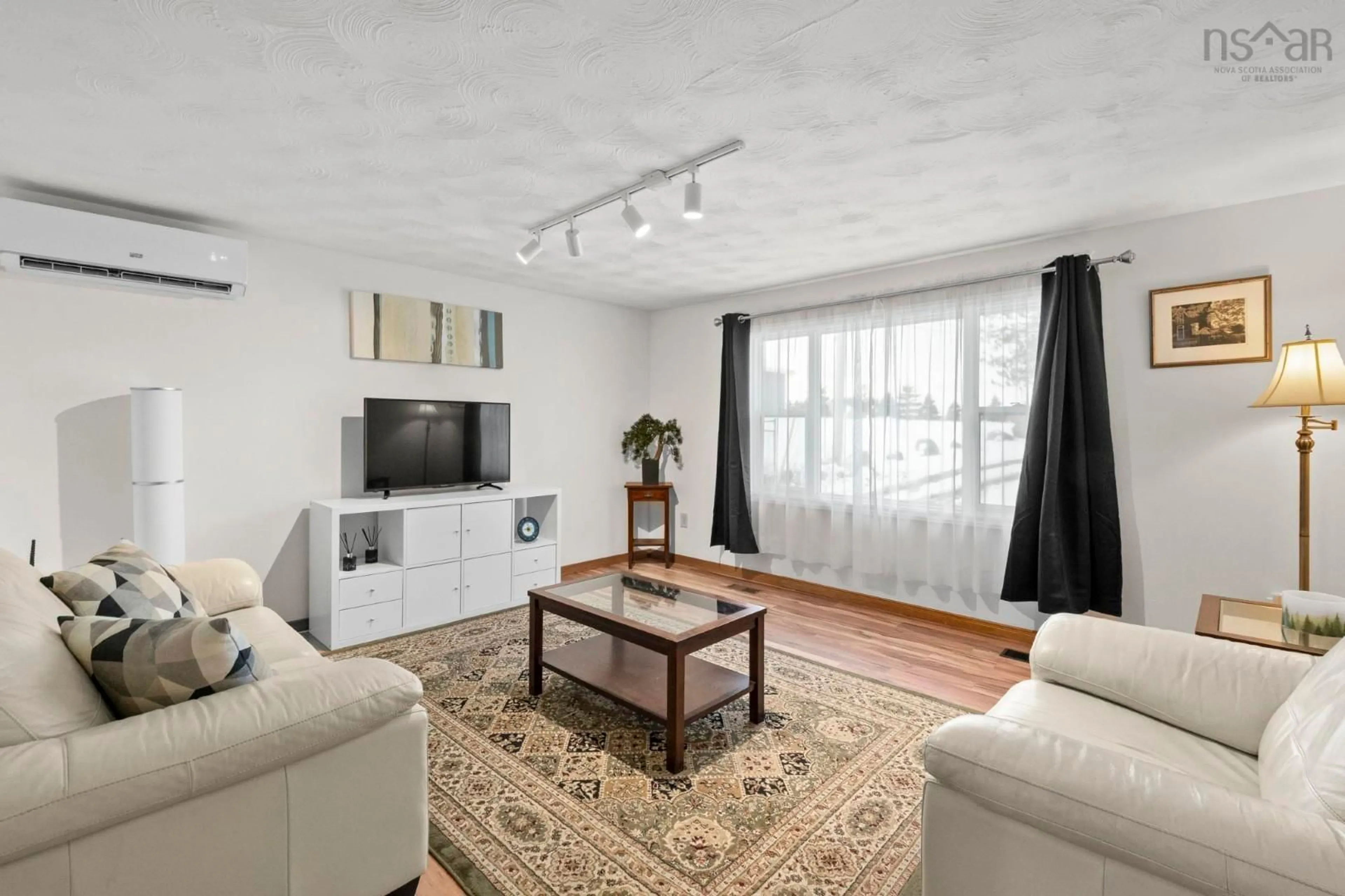 Living room with furniture, unknown for 27 Back Lane, Terence Bay Nova Scotia B3J 1Y3