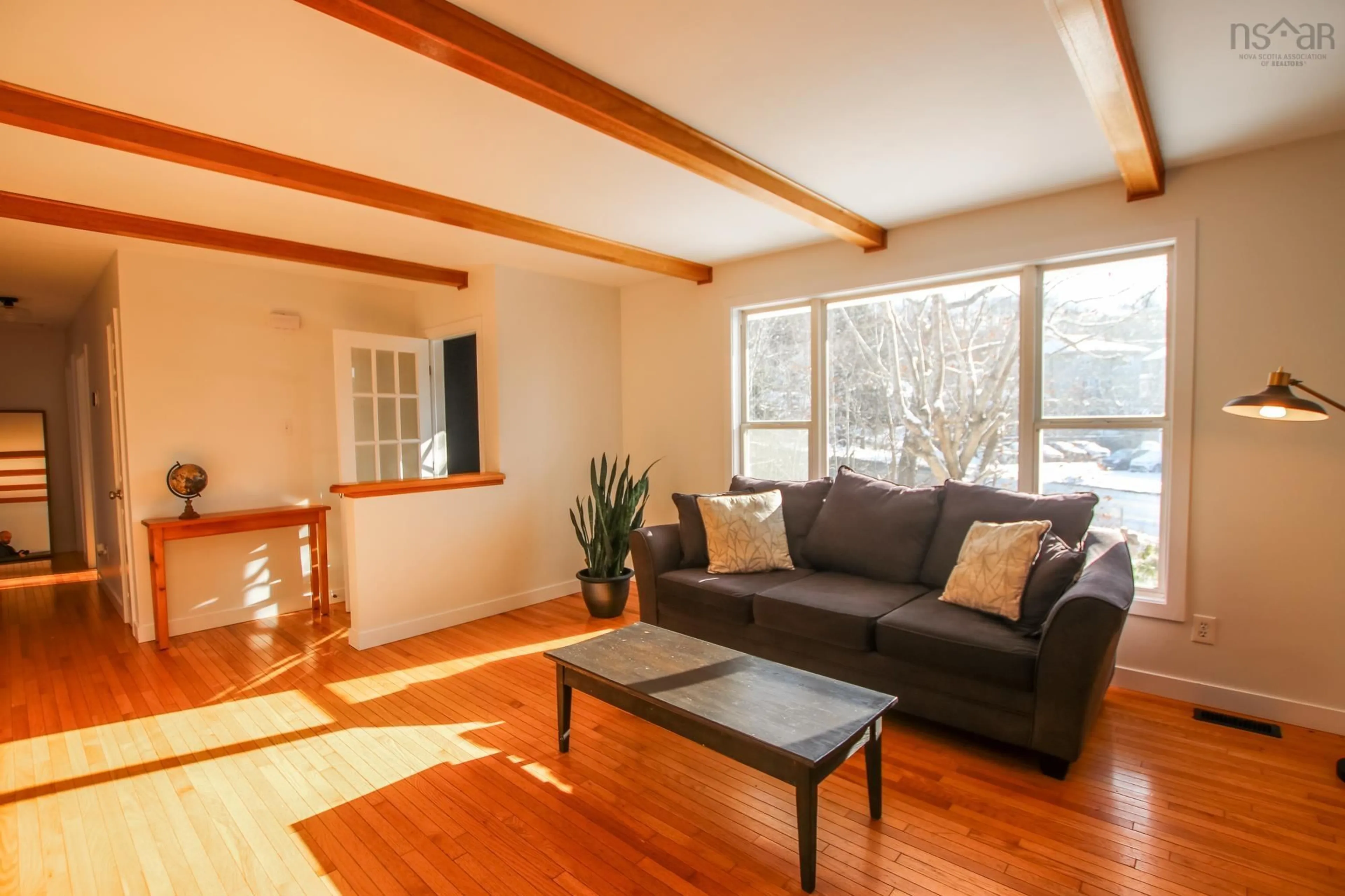 Living room with furniture, wood/laminate floor for 34-38 Dartmouth Rd, Bedford Nova Scotia B4A 2L2