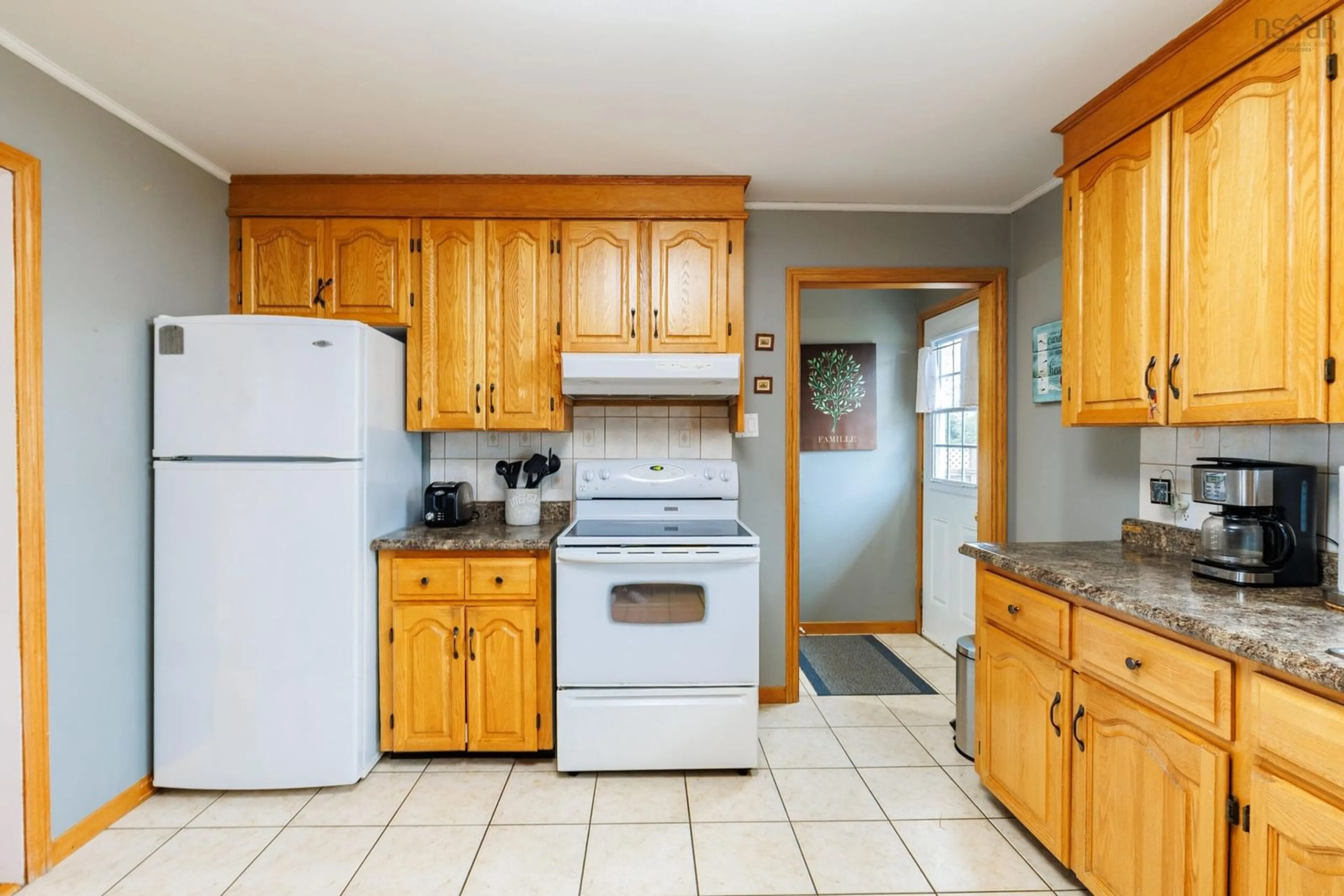 Standard kitchen, ceramic/tile floor for 32 Chemin Des Bourque, Ste. Anne Du Ruisseau Nova Scotia B0W 2X0