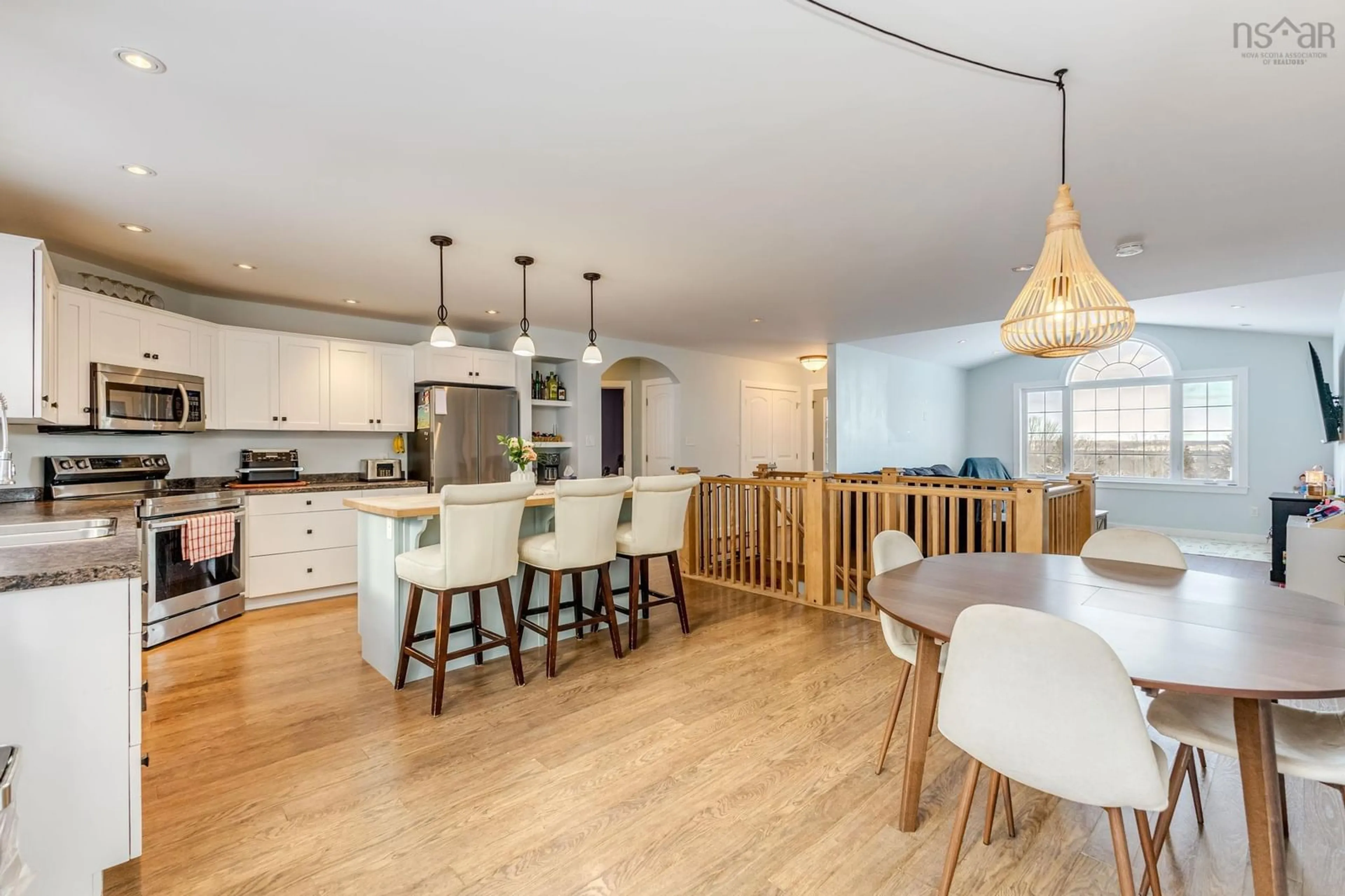 Open concept kitchen, wood/laminate floor for 61 Fourth St, Maclellan's Brook Nova Scotia B2H 5C7