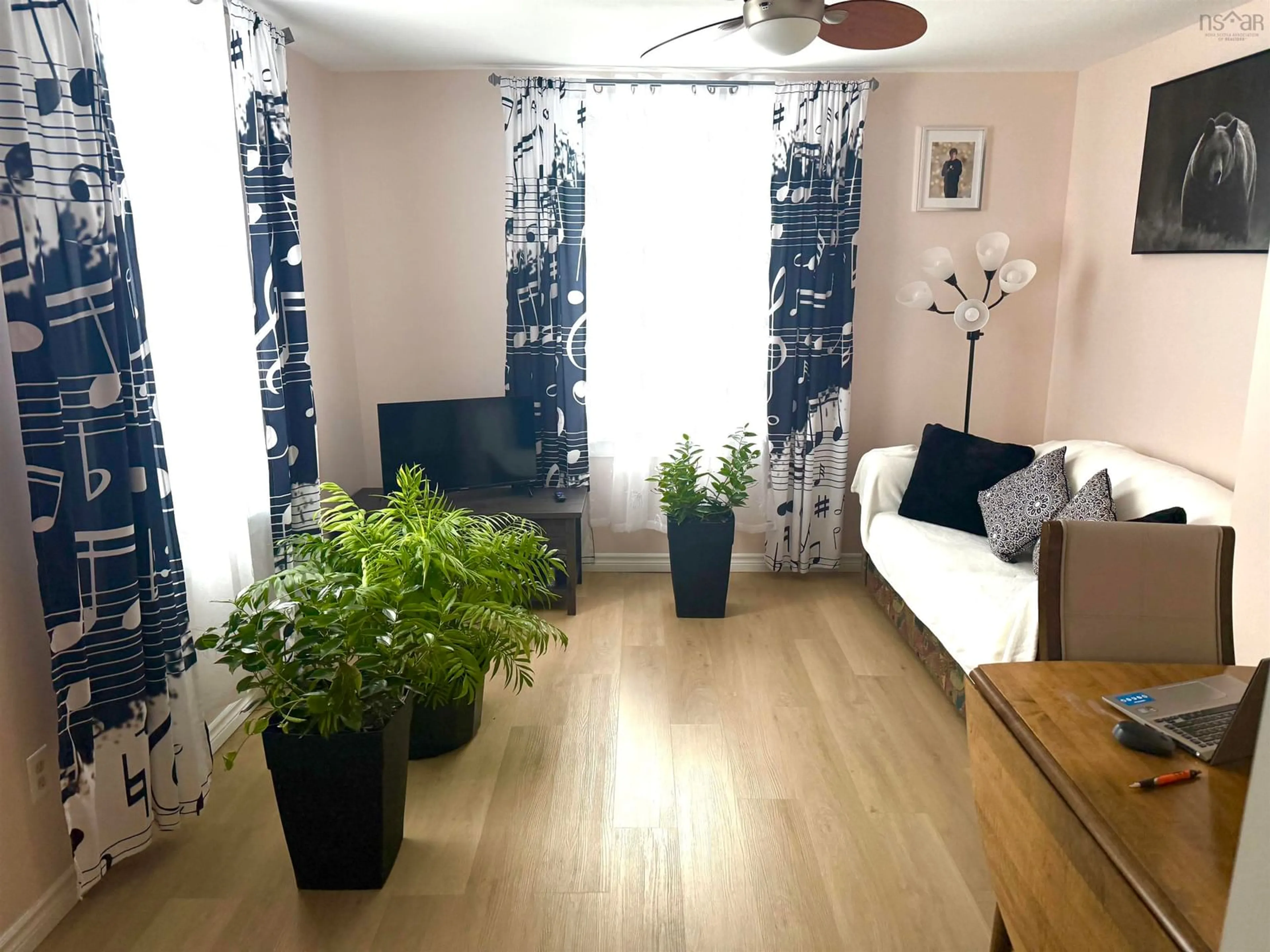 Living room with furniture, wood/laminate floor for 18 Oak St, Trenton Nova Scotia B0K 1X0