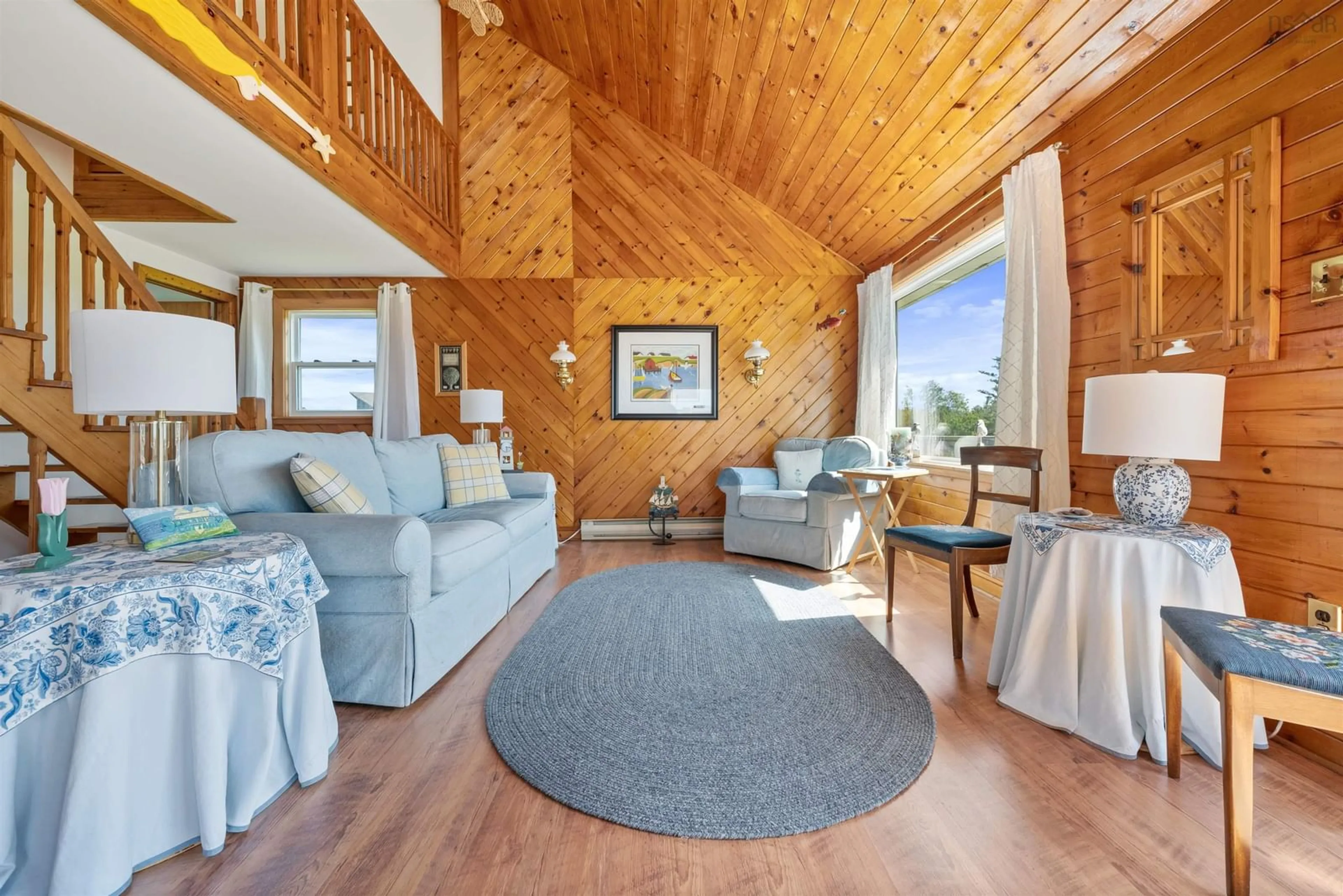 Living room with furniture, wood/laminate floor for 23 Hilltop Lane, Caribou Island Nova Scotia B0K 1H0