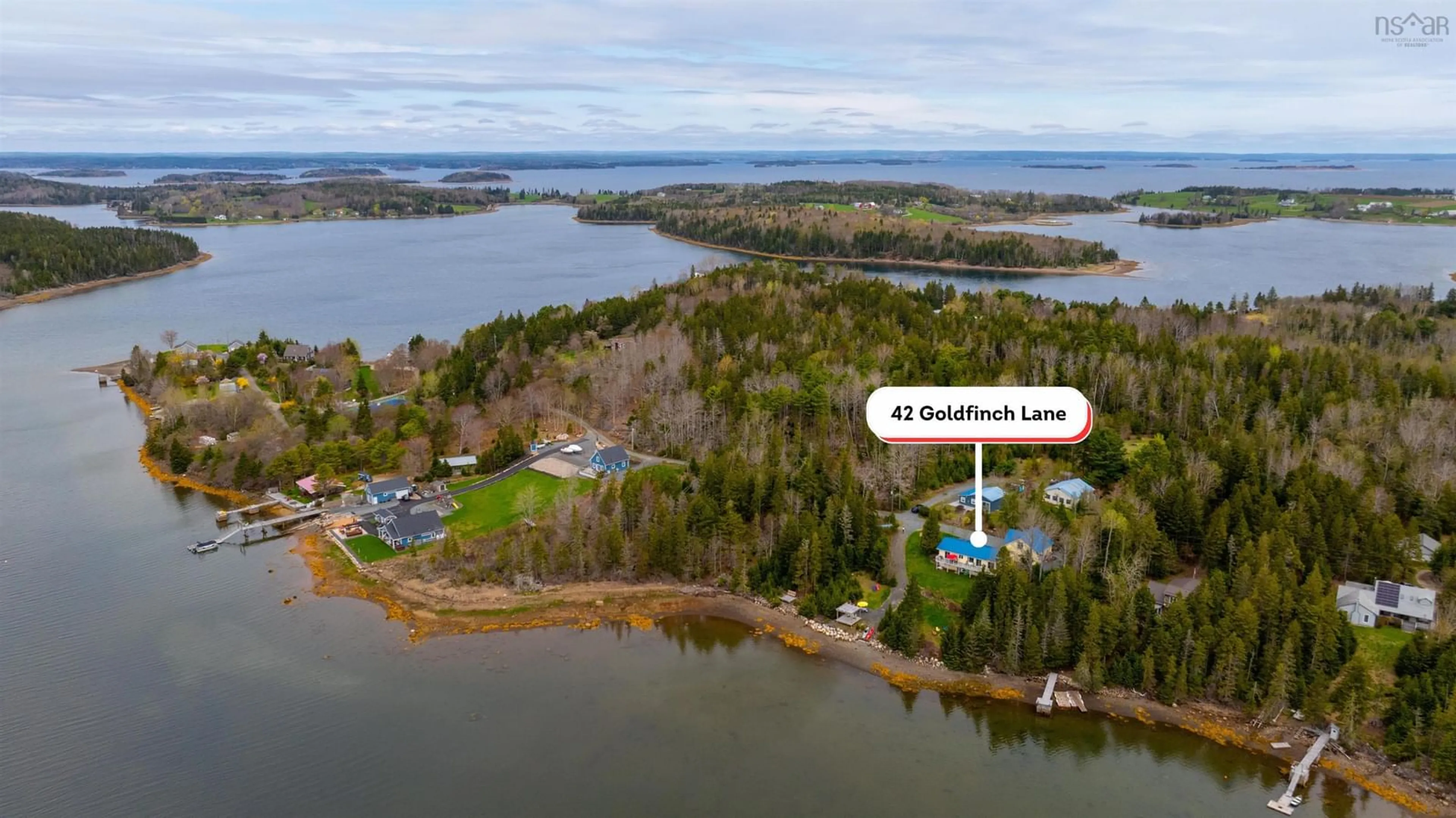 A pic from outside/outdoor area/front of a property/back of a property/a pic from drone, water/lake/river/ocean view for 42 Goldfinch Lane, Heckmans Island Nova Scotia B0J 2C0