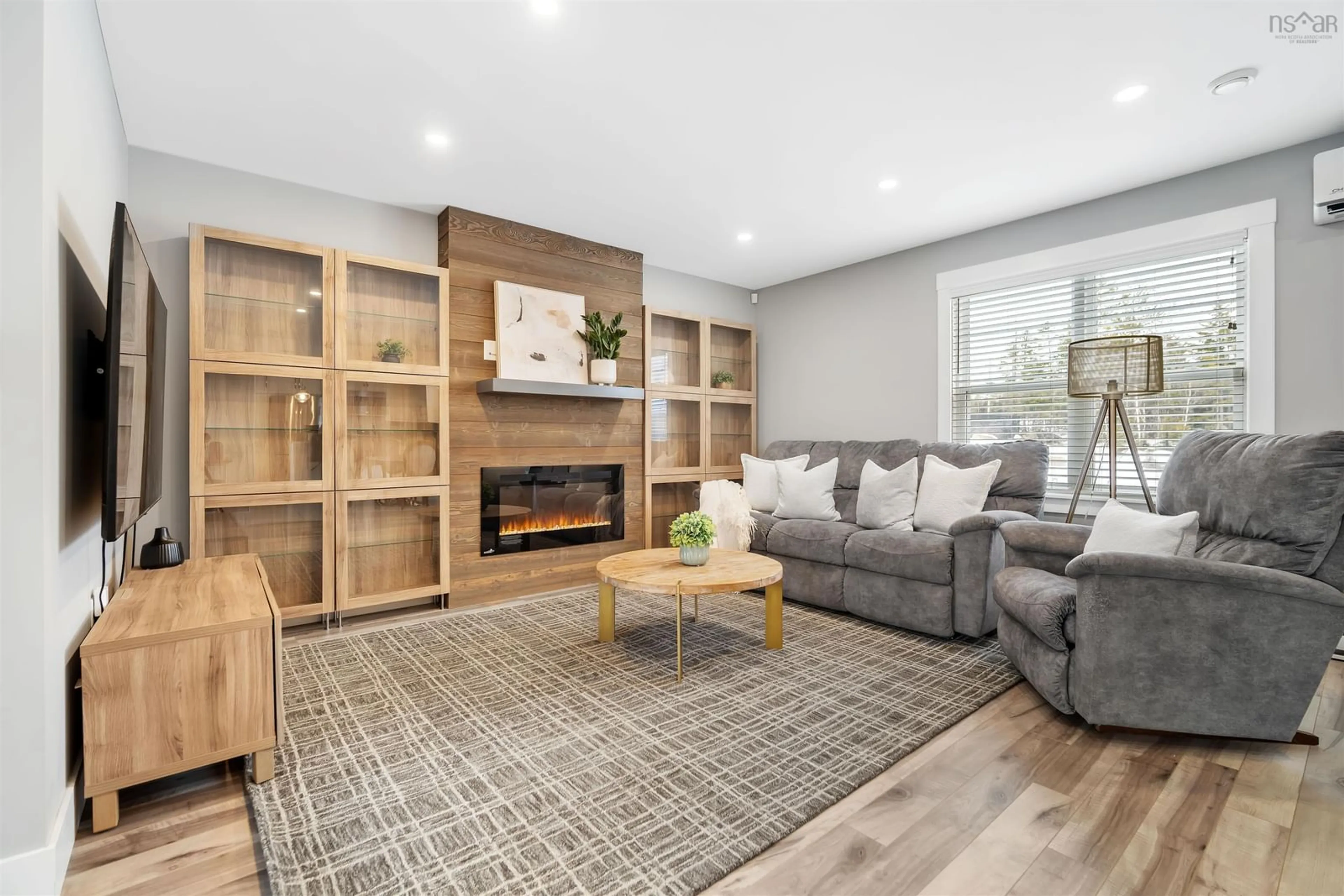 Living room with furniture, wood/laminate floor for 1465 Mccabe Lake Dr, Middle Sackville Nova Scotia B4E 0P5