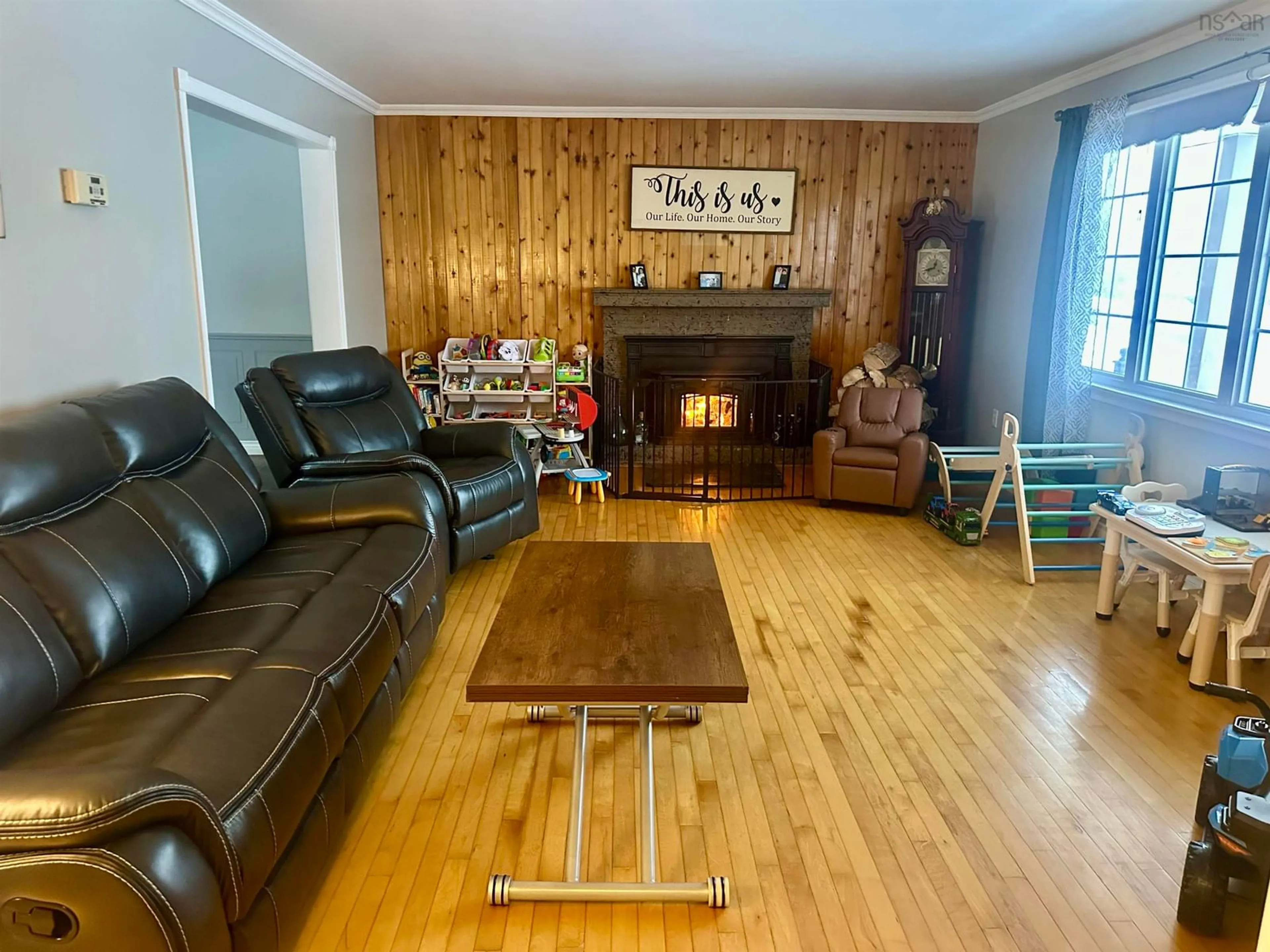Living room with furniture, wood/laminate floor for 42 Napean St, Port Hawkesbury Nova Scotia B9A 1P2