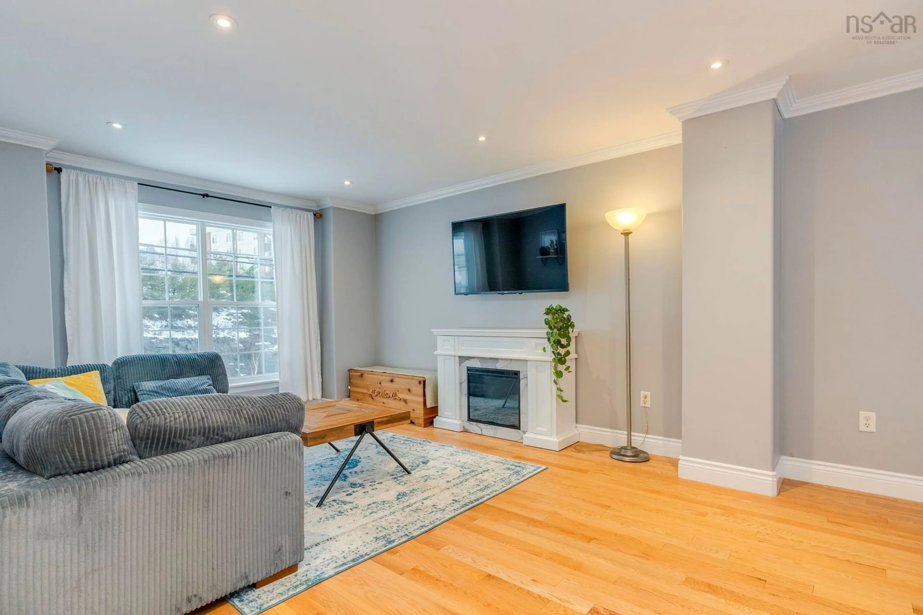 Living room with furniture, wood/laminate floor for 102 Larry Uteck Blvd, Halifax Nova Scotia B3M 4Y2
