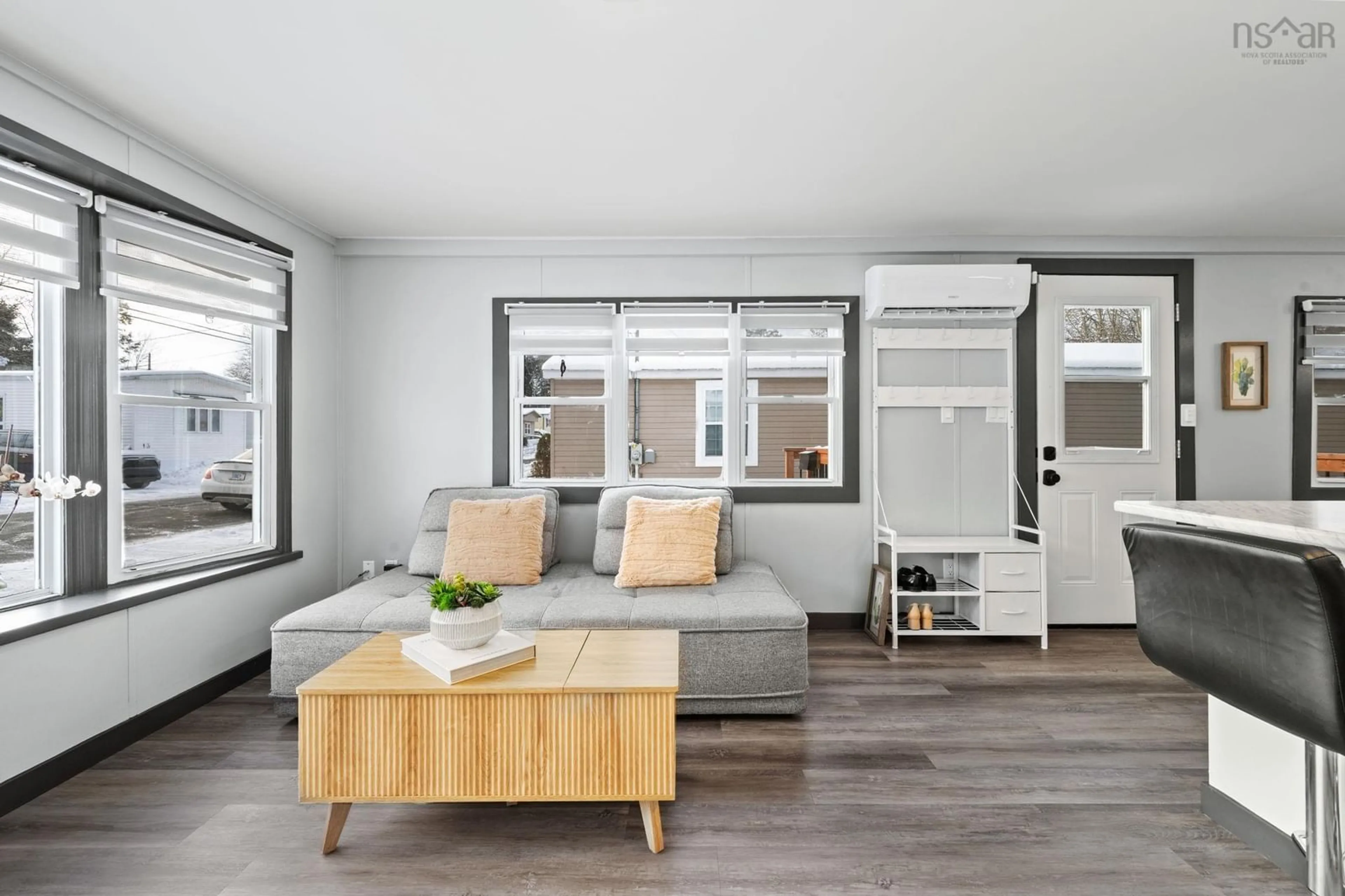 Living room with furniture, wood/laminate floor for 12 Stanley St, Middle Sackville Nova Scotia B4E 1E9