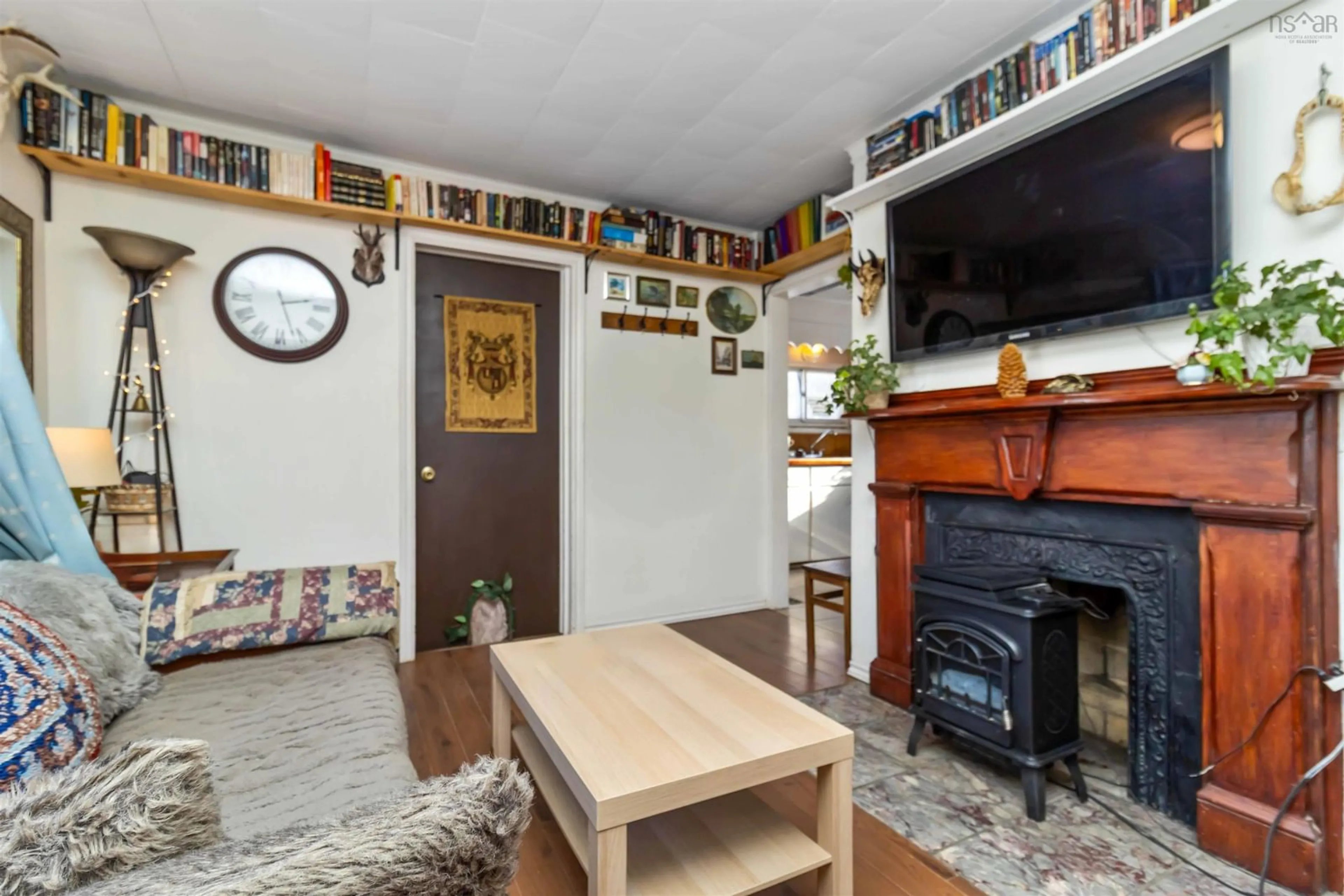 Living room with furniture, wood/laminate floor for 23 Military Rd, Halifax Nova Scotia B3P 0K3