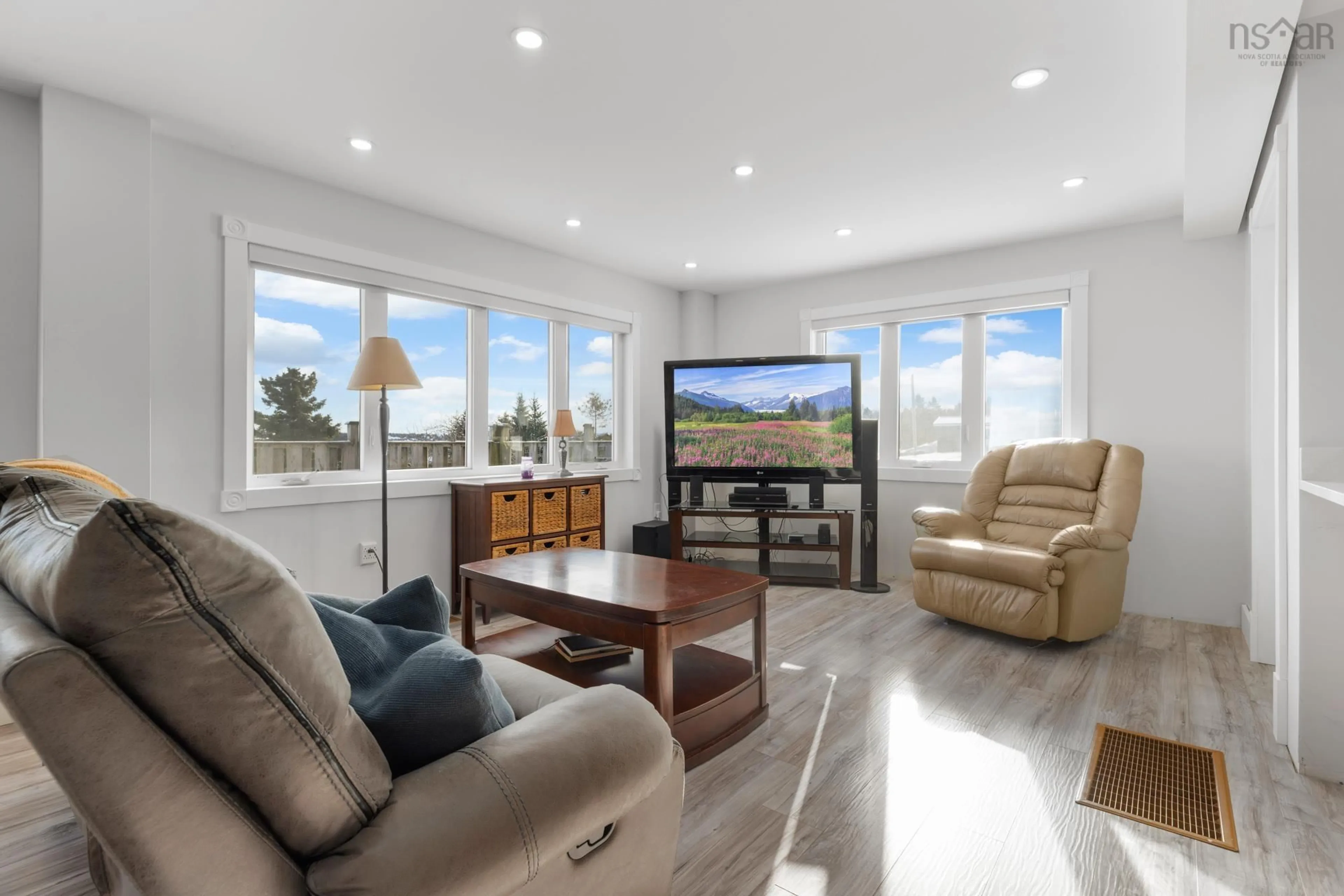 Living room with furniture, wood/laminate floor for 1454 Terence Bay Rd, Terence Bay Nova Scotia B3T 1X7