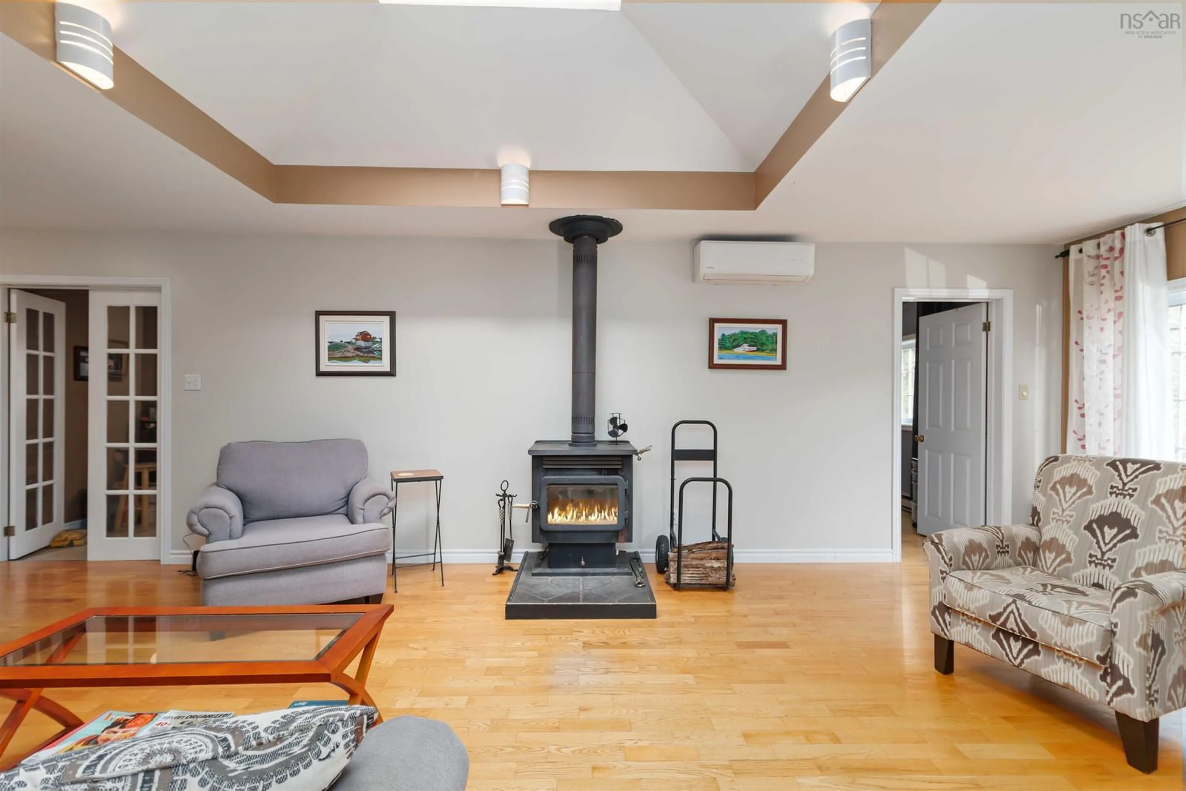 Living room with furniture, wood/laminate floor for 64 Irene Ave, Lower Sackville Nova Scotia B4E 1H7