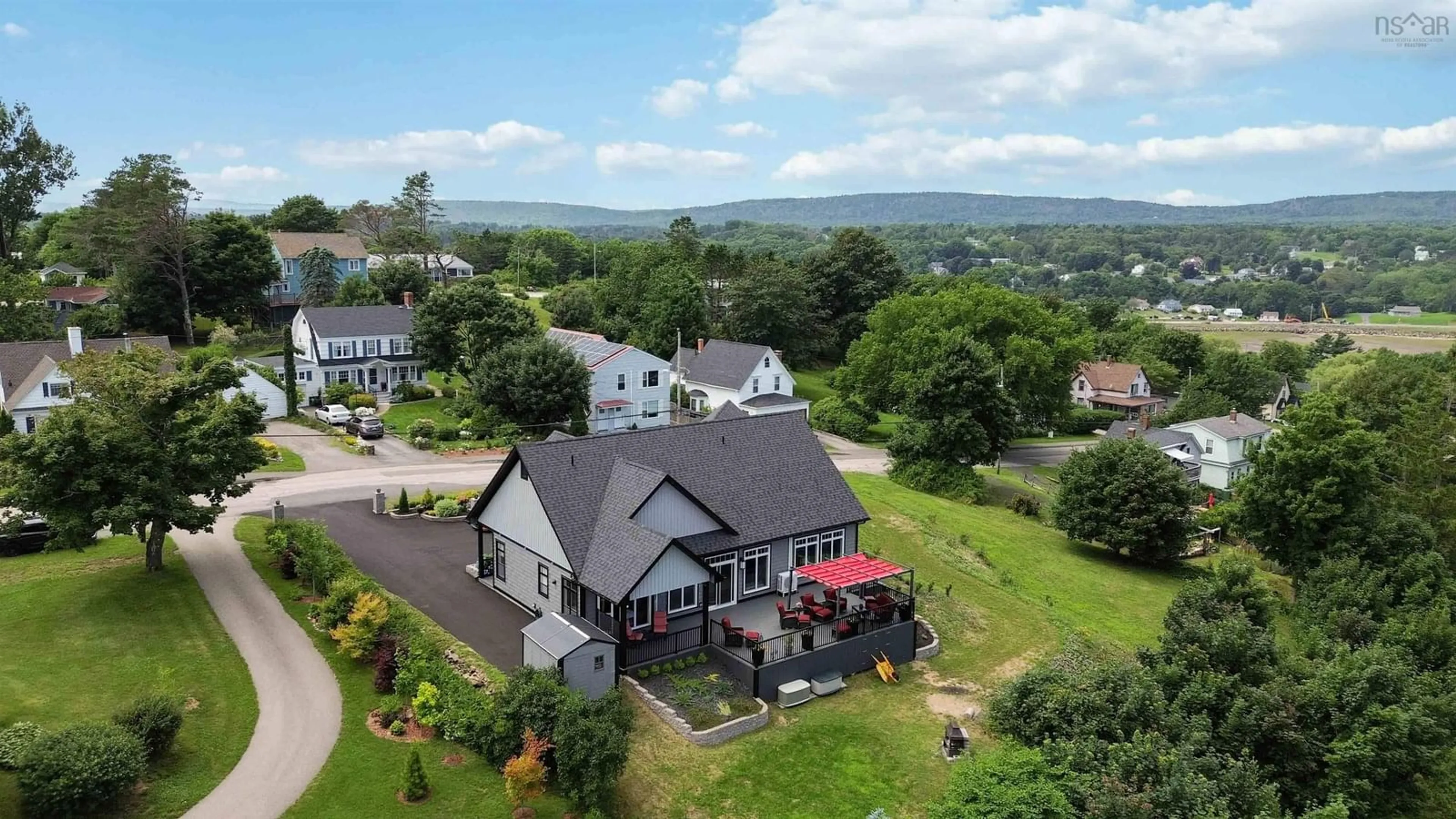 A pic from outside/outdoor area/front of a property/back of a property/a pic from drone, mountain view for 180 King St, Digby Nova Scotia B0V 1A0