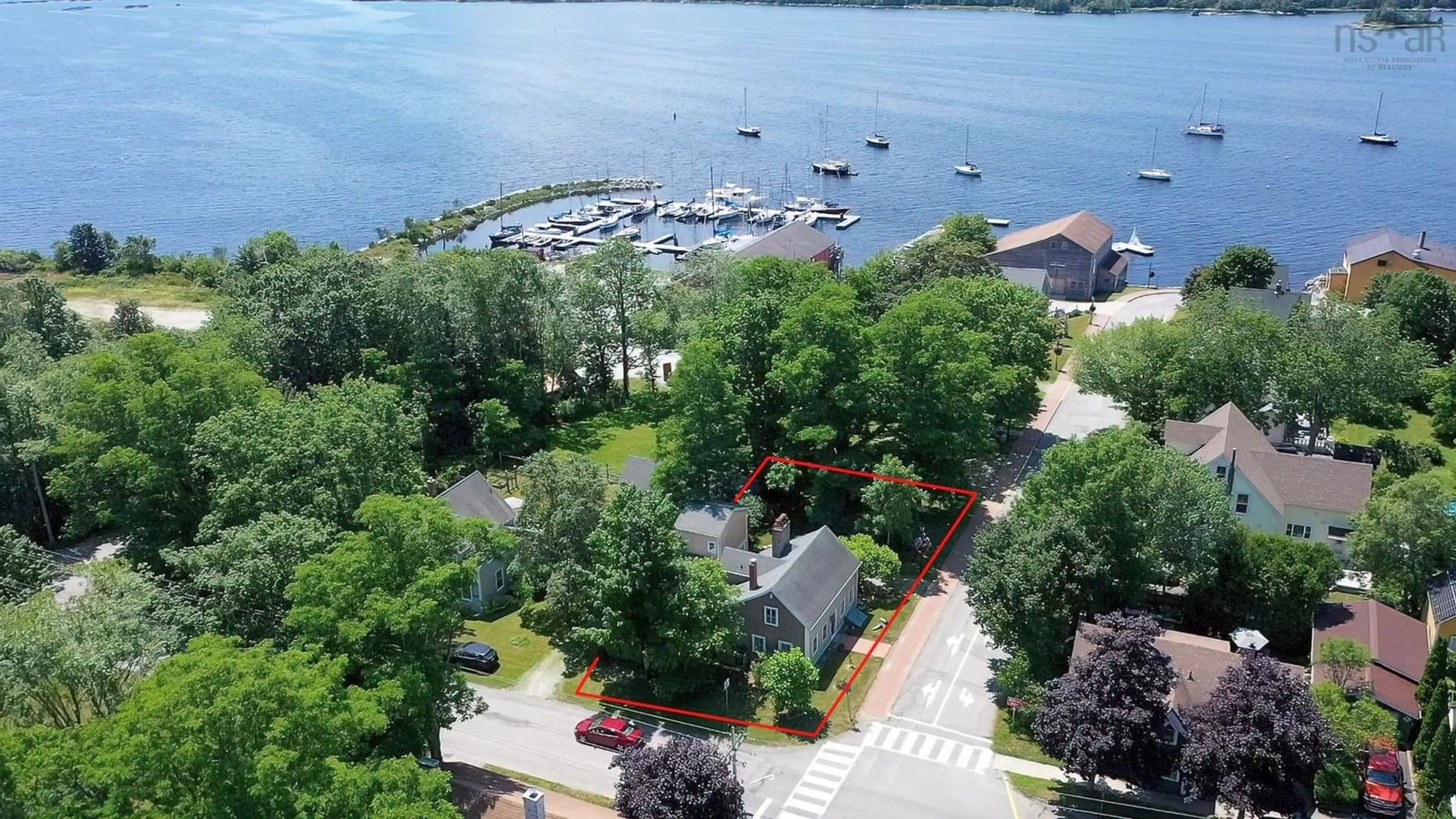 A pic from outside/outdoor area/front of a property/back of a property/a pic from drone, water/lake/river/ocean view for 17 George St, Shelburne Nova Scotia B0T 1W0