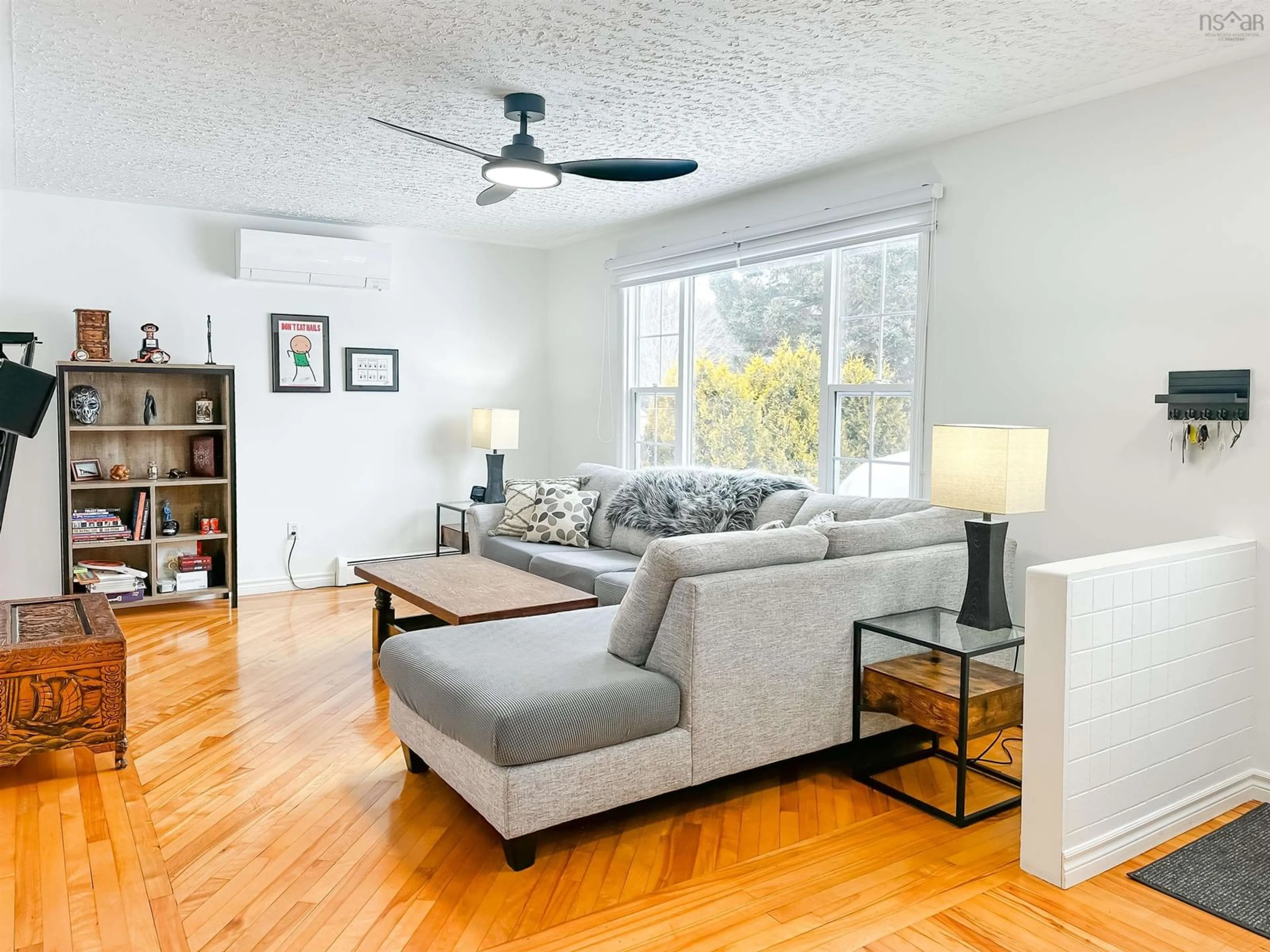Living room with furniture, wood/laminate floor for 352 Moody Crt, Kingston Nova Scotia B0P 1R0