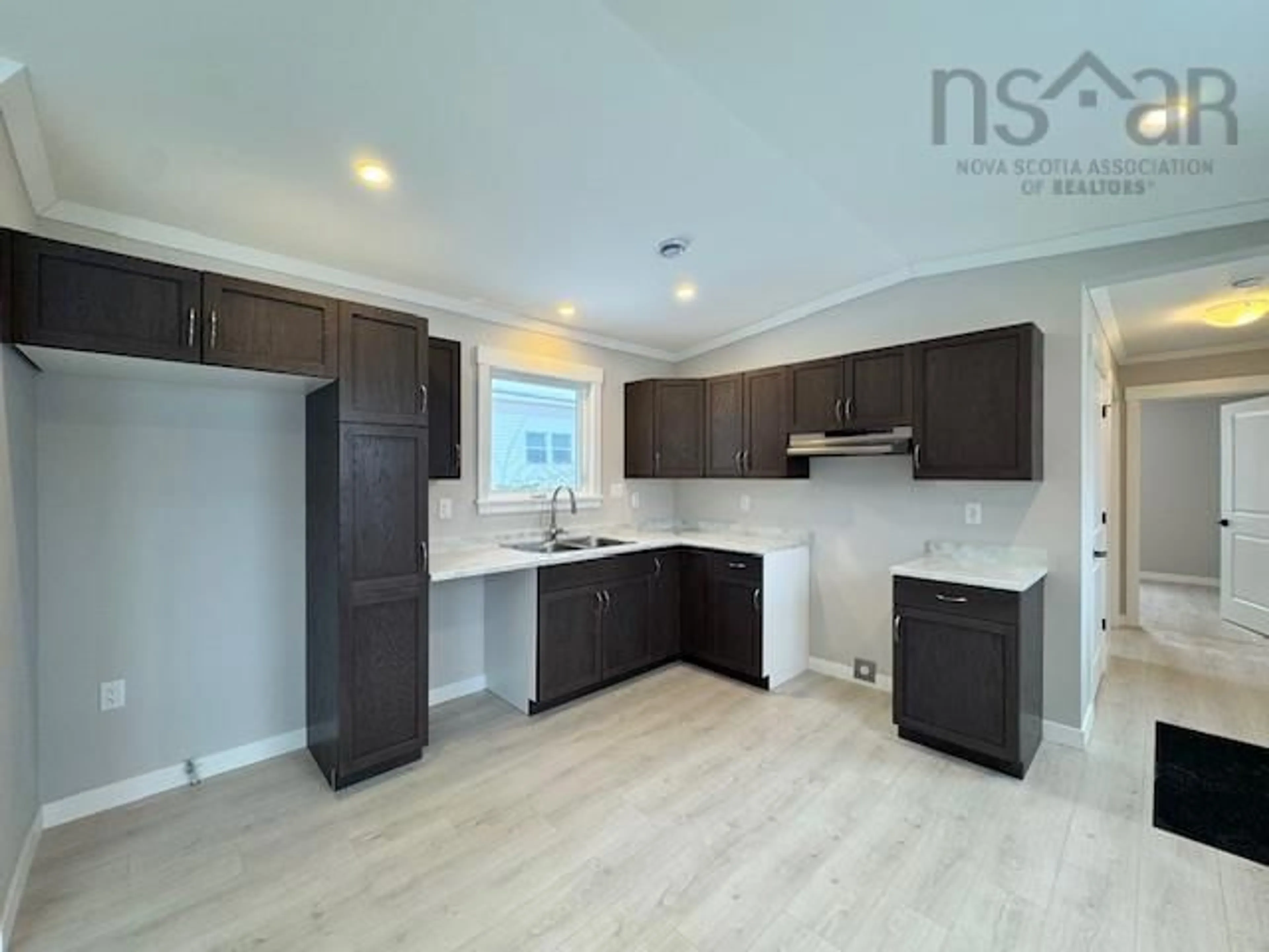 Open concept kitchen, wood/laminate floor for 1182 Susan Dr, Beaver Bank Nova Scotia B4E 1P1