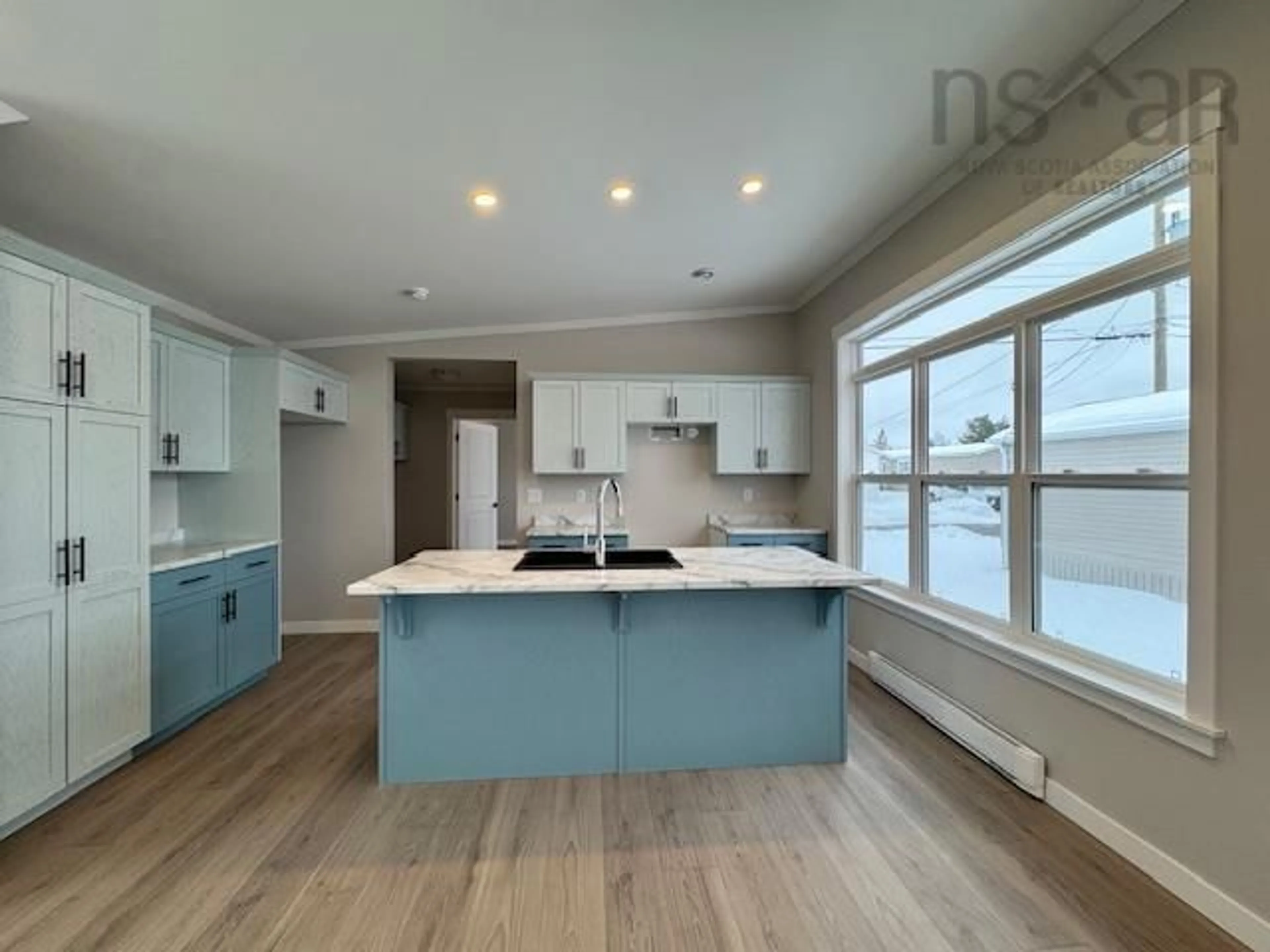 Open concept kitchen, wood/laminate floor for 16 Christopher Ave, Mount Uniacke Nova Scotia B0N 1Z0