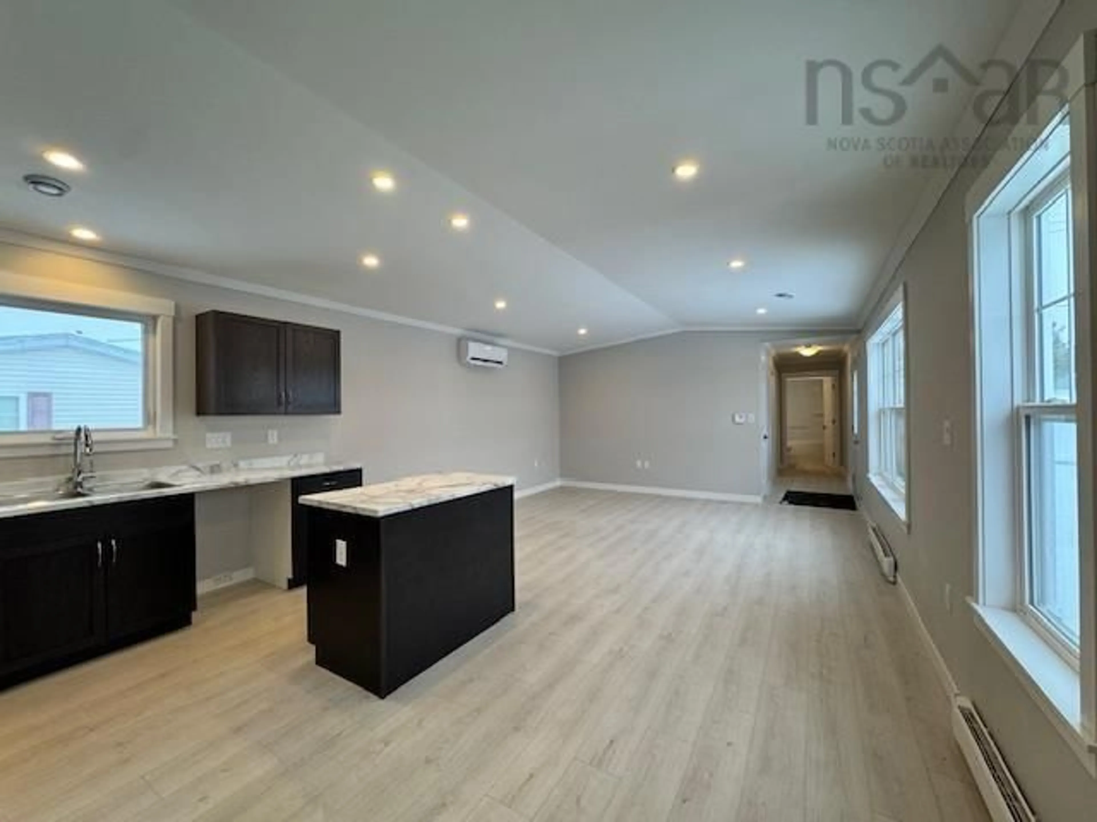 Open concept kitchen, wood/laminate floor for 12 Christopher Ave, Mount Uniacke Nova Scotia B0N 1Z0