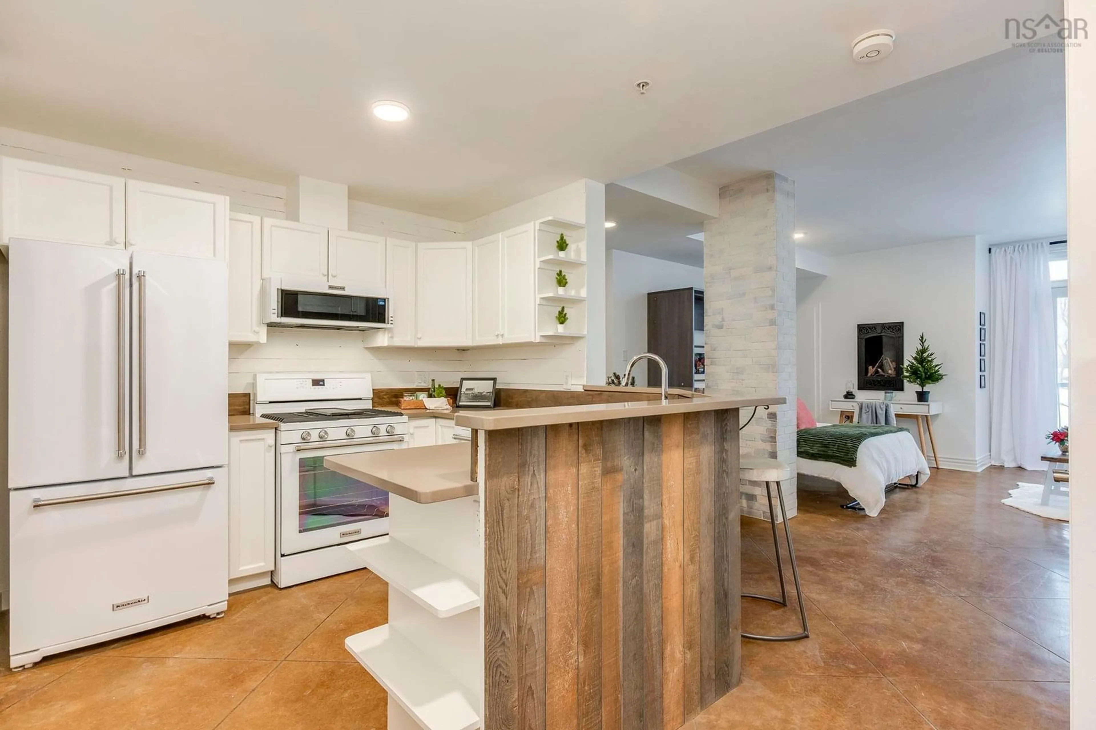 Open concept kitchen, wood/laminate floor for 70 Ochterloney St #407, Dartmouth Nova Scotia B2Y 1C2