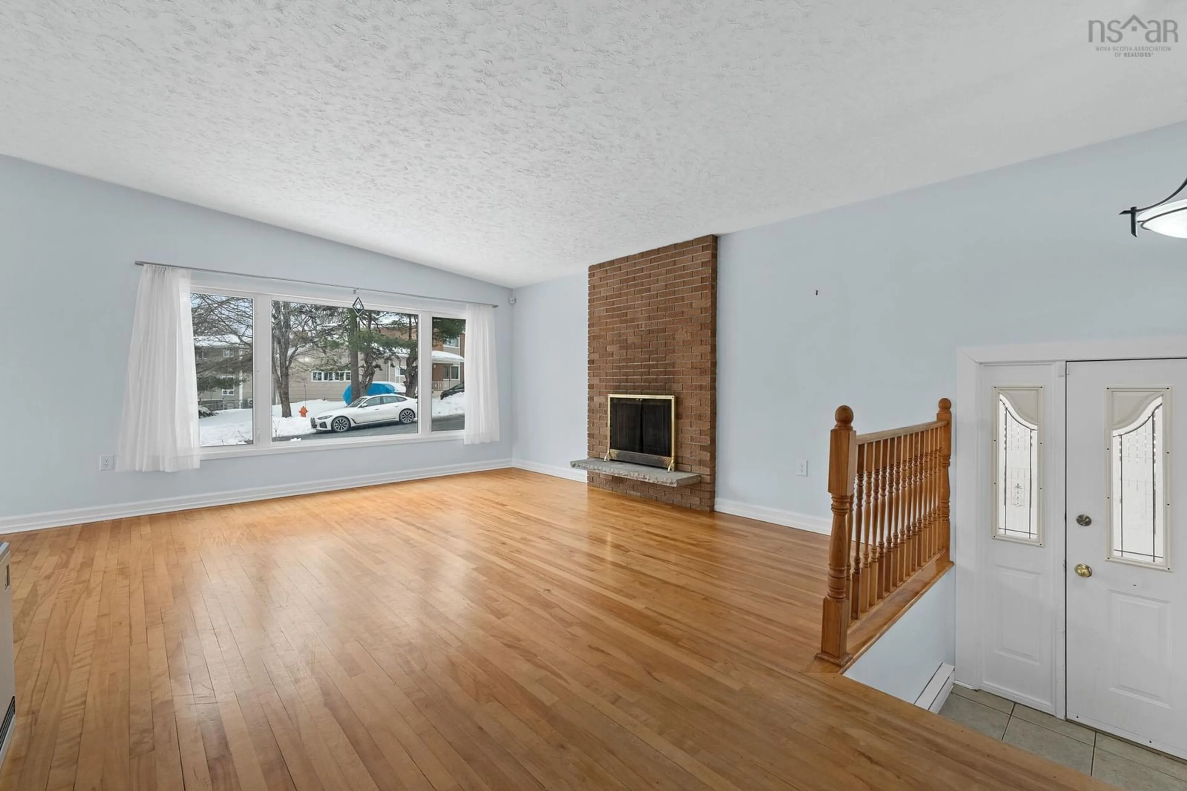 Living room with furniture, wood/laminate floor for 69 Deepwood Cres, Halifax Nova Scotia B3M 2Y5