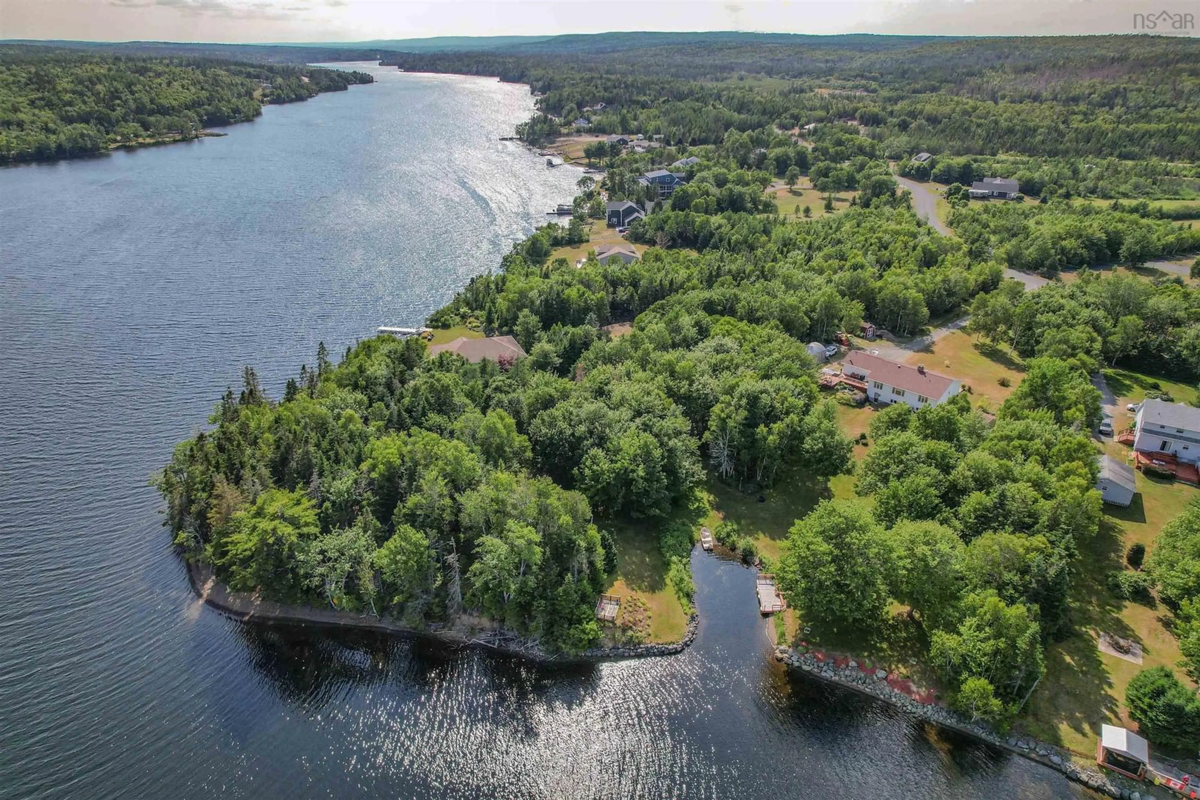 A pic from outside/outdoor area/front of a property/back of a property/a pic from drone, water/lake/river/ocean view for 166 Oakfield Dr, Marion Bridge Nova Scotia B1K 3N7