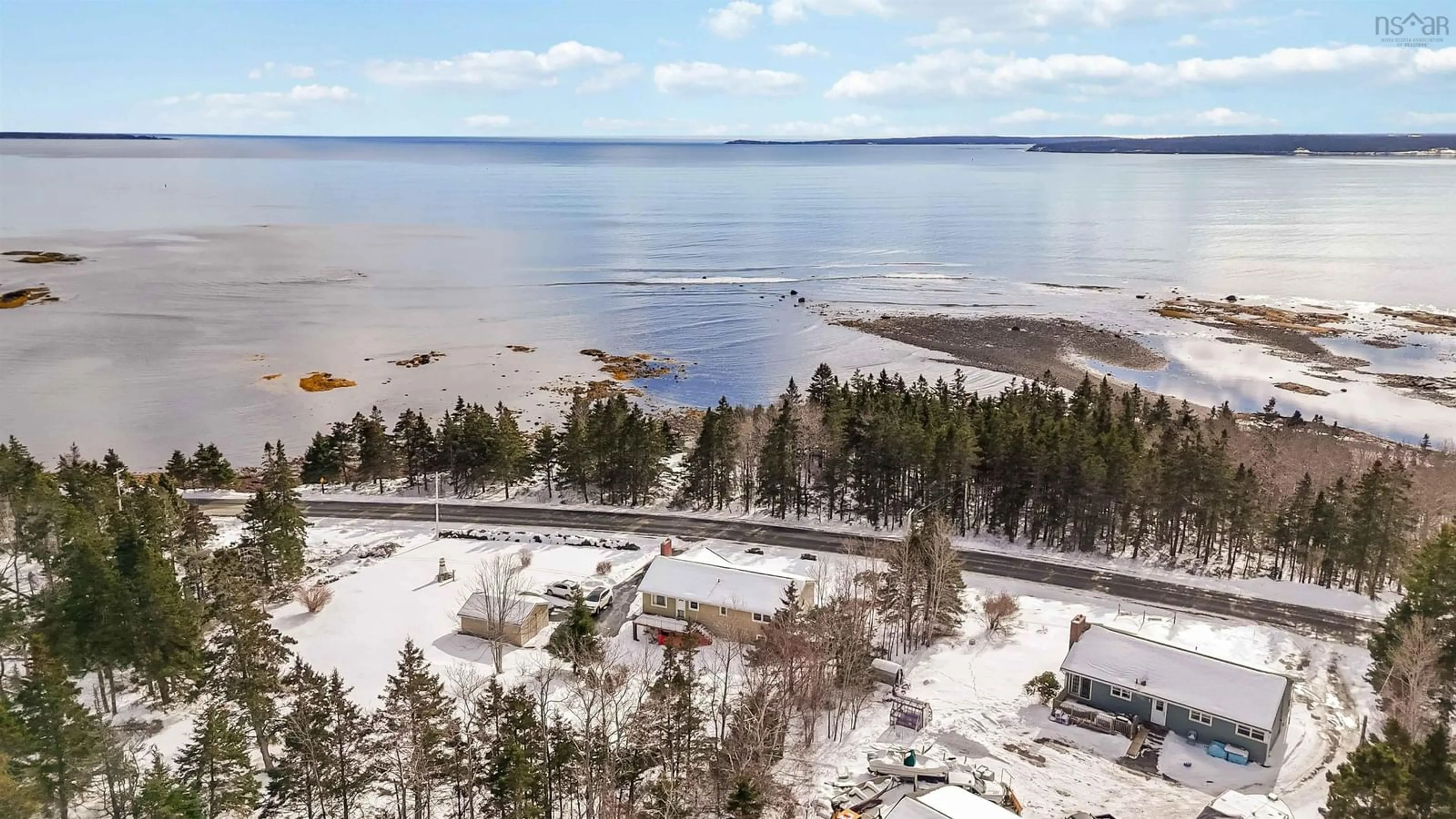 A pic from outside/outdoor area/front of a property/back of a property/a pic from drone, water/lake/river/ocean view for 1157 Blue Rocks Rd, Blue Rocks Nova Scotia B0J 2C0