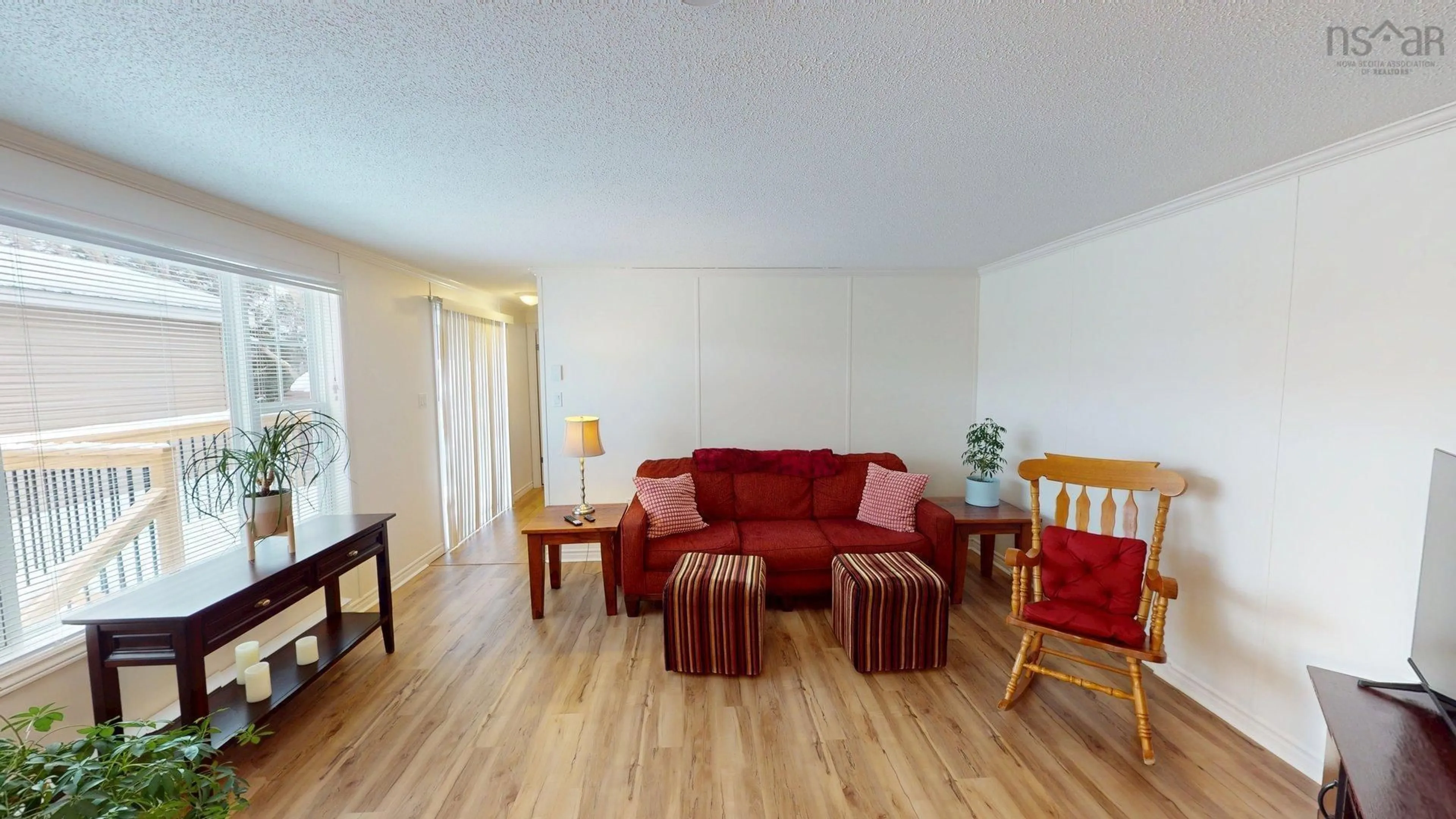Living room with furniture, wood/laminate floor for 18 Hazel St, Sackville Estates Nova Scotia B4E 1E4