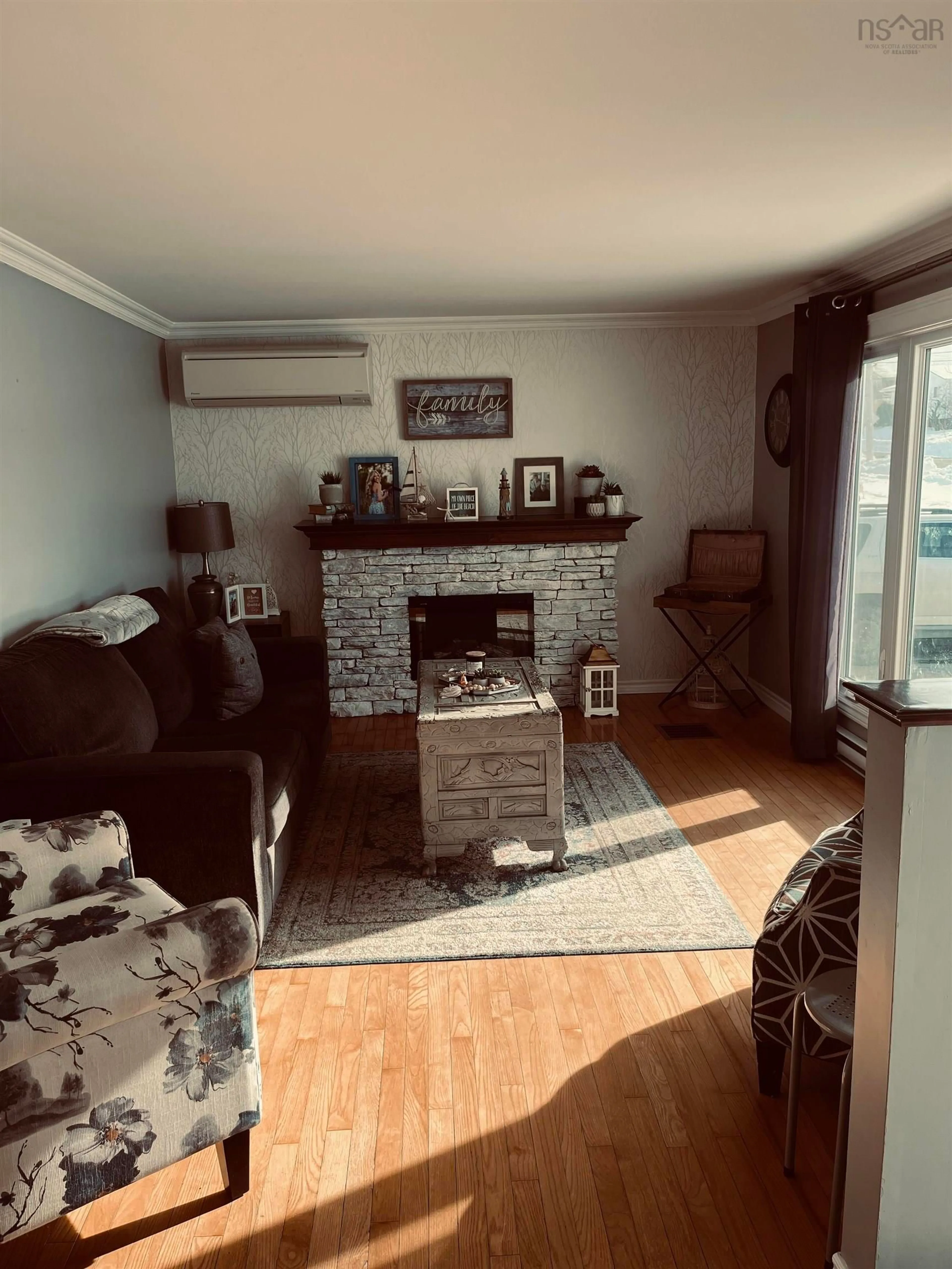 Living room with furniture, wood/laminate floor for 10 Don-Gordon St, Glace Bay Nova Scotia B1A 6A2
