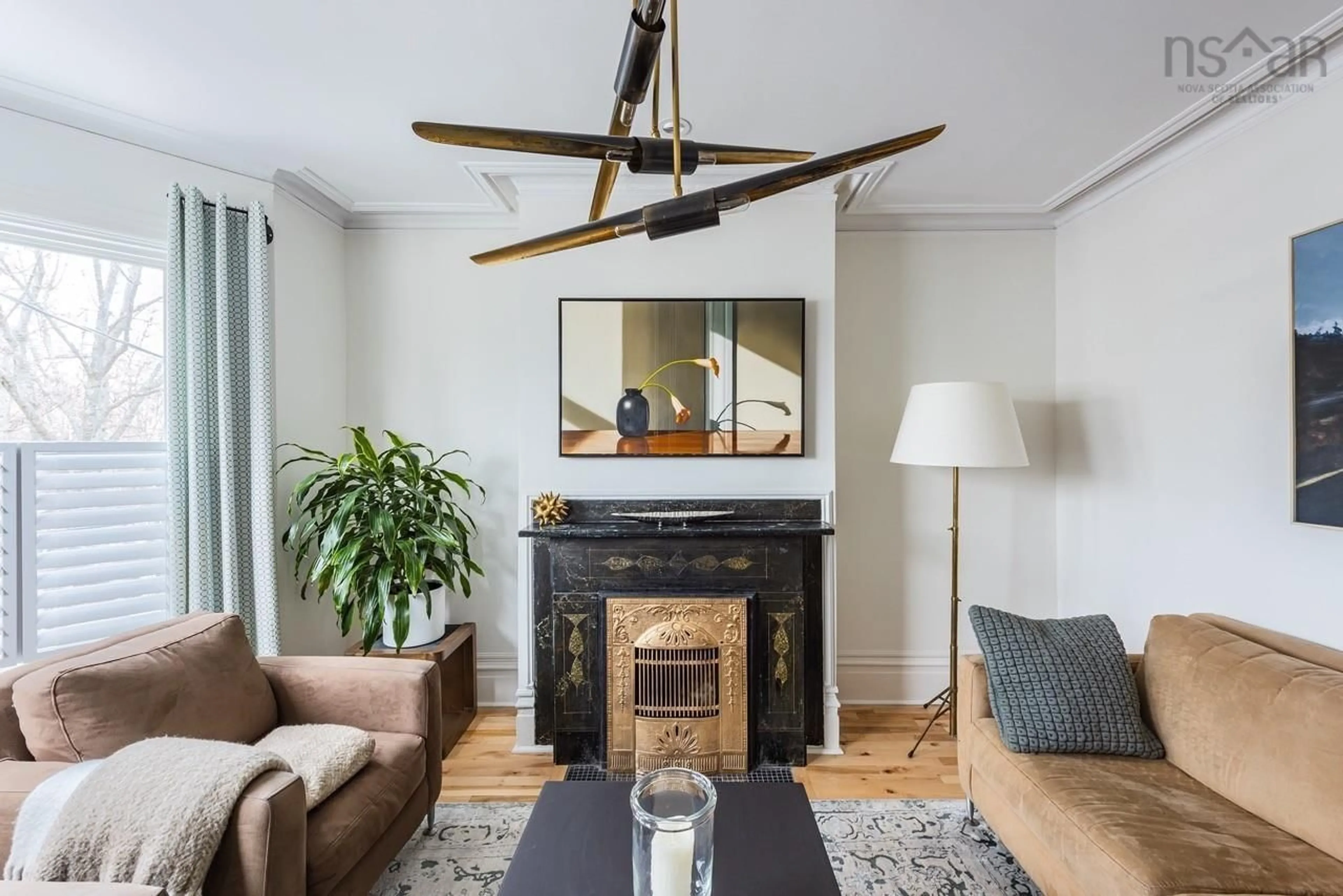 Living room with furniture, wood/laminate floor for 6284-86 Chebucto Rd, Halifax Nova Scotia B3L 1K8