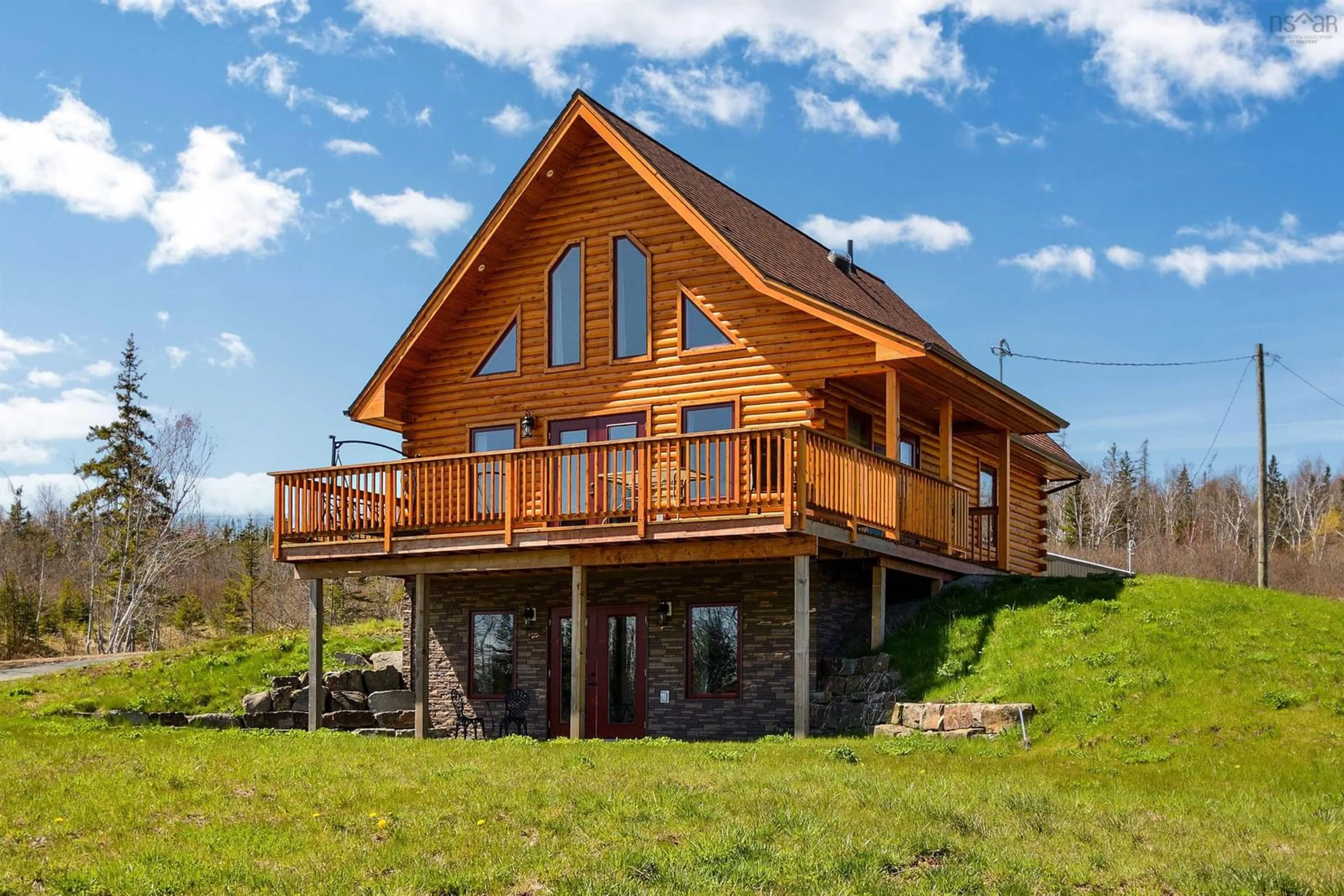 Home with vinyl exterior material, building for 1005 205 Hwy, Baddeck Nova Scotia B0E 1B0