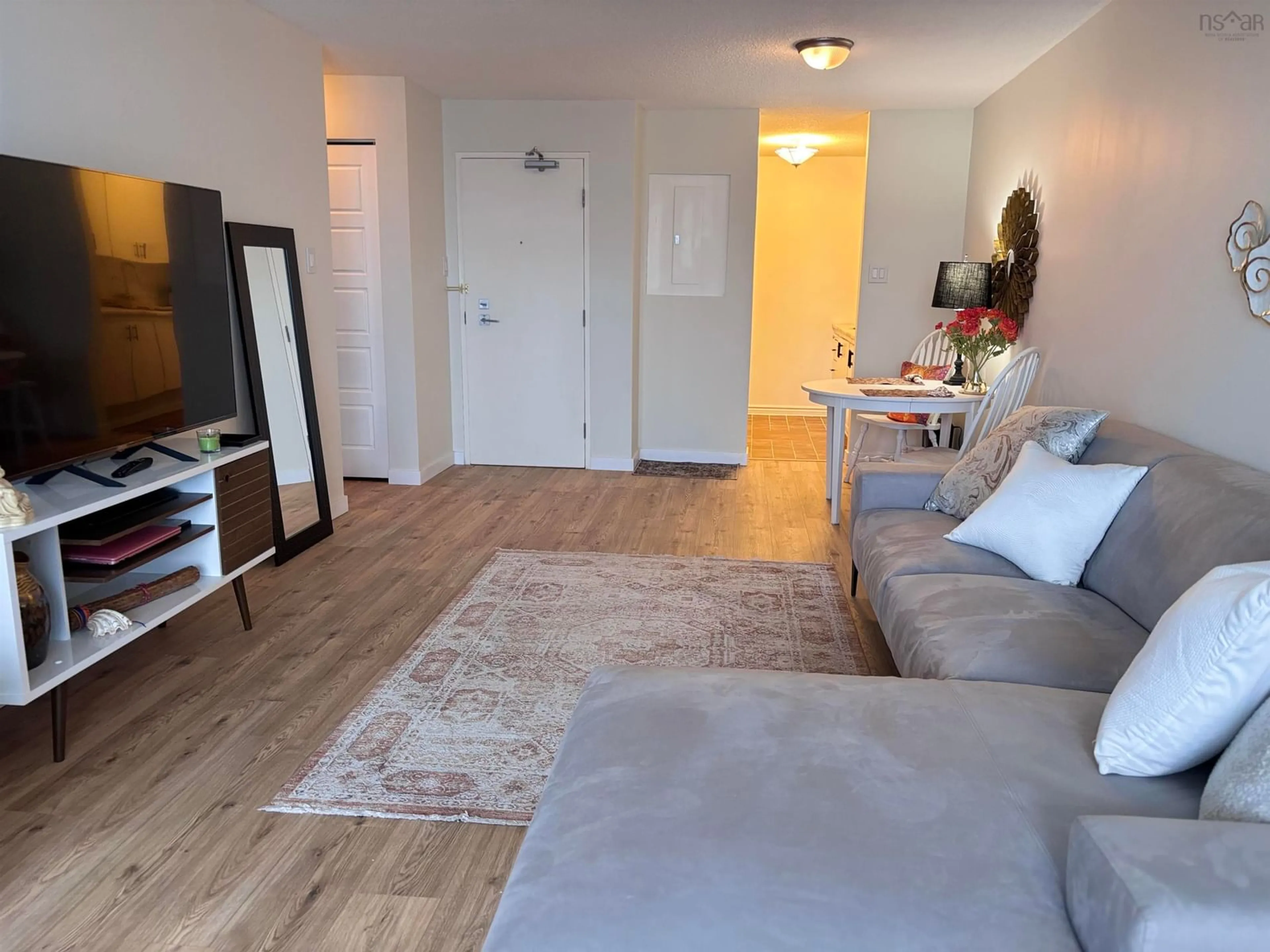 Living room with furniture, wood/laminate floor for 5572 North Ridge Rd #1002, Halifax Nova Scotia B3K 5K2