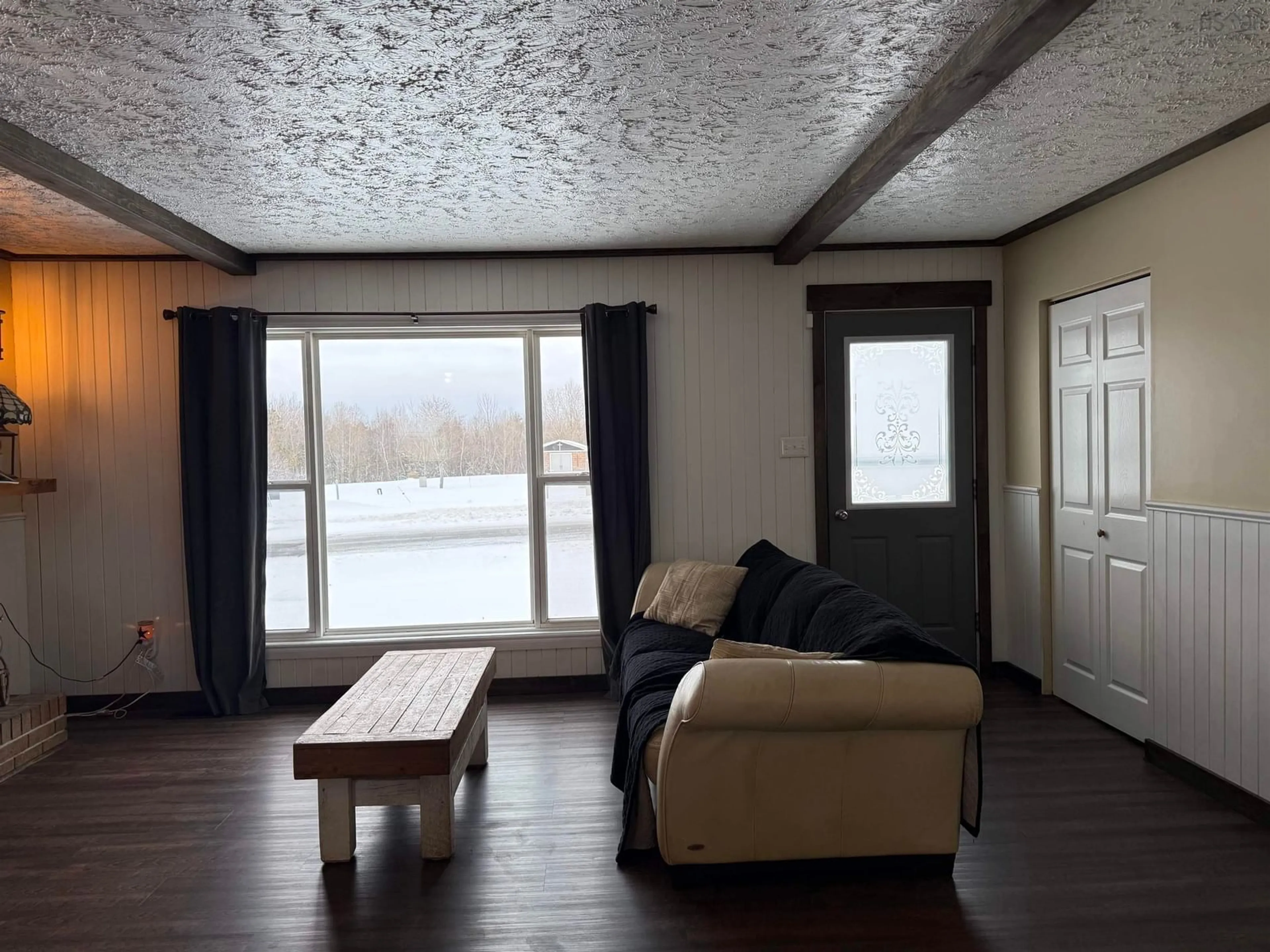 Living room with furniture, wood/laminate floor for 1668 Mackay St, Westville Nova Scotia B0K 2A0