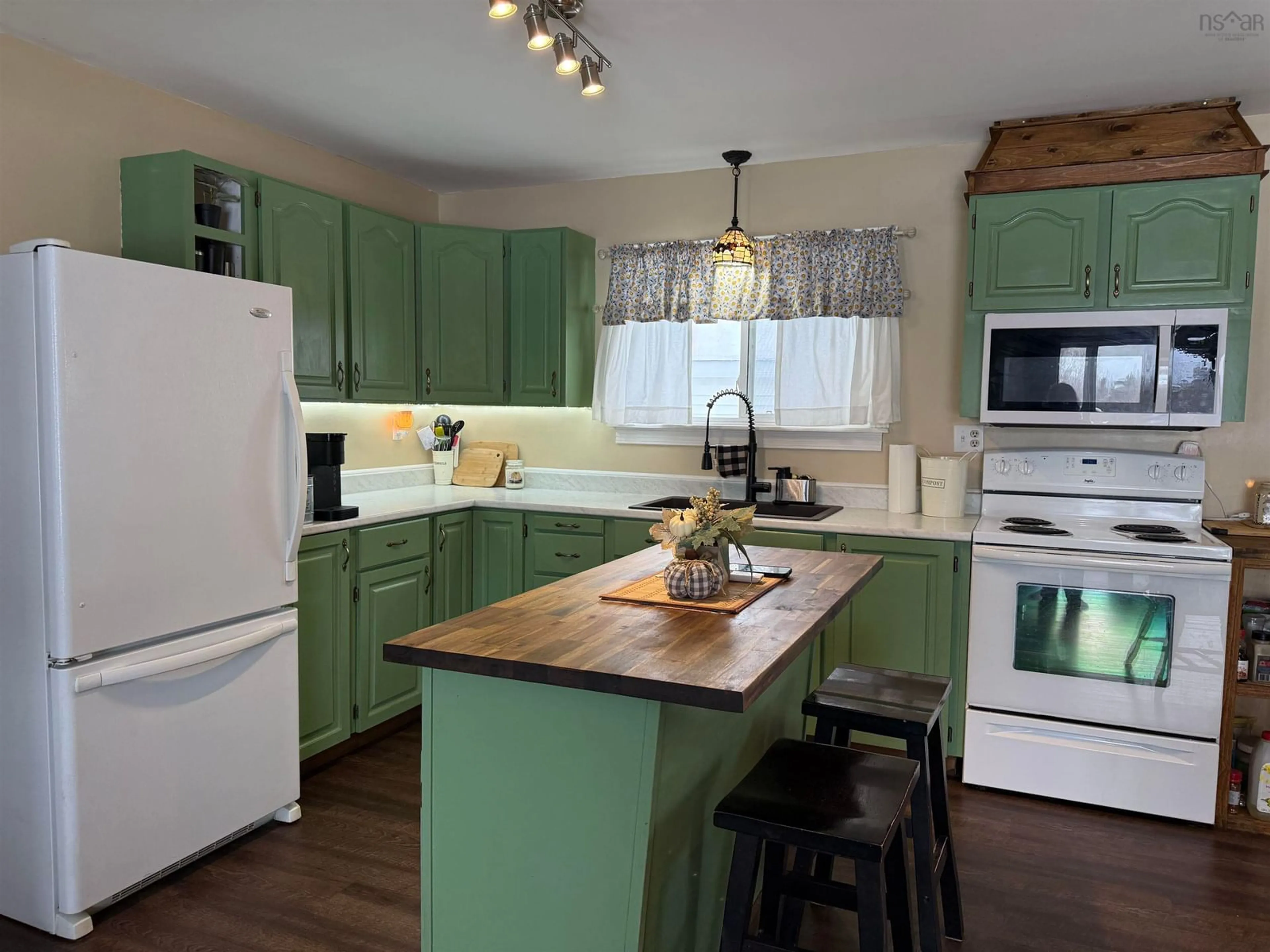 Open concept kitchen, wood/laminate floor for 1668 Mackay St, Westville Nova Scotia B0K 2A0