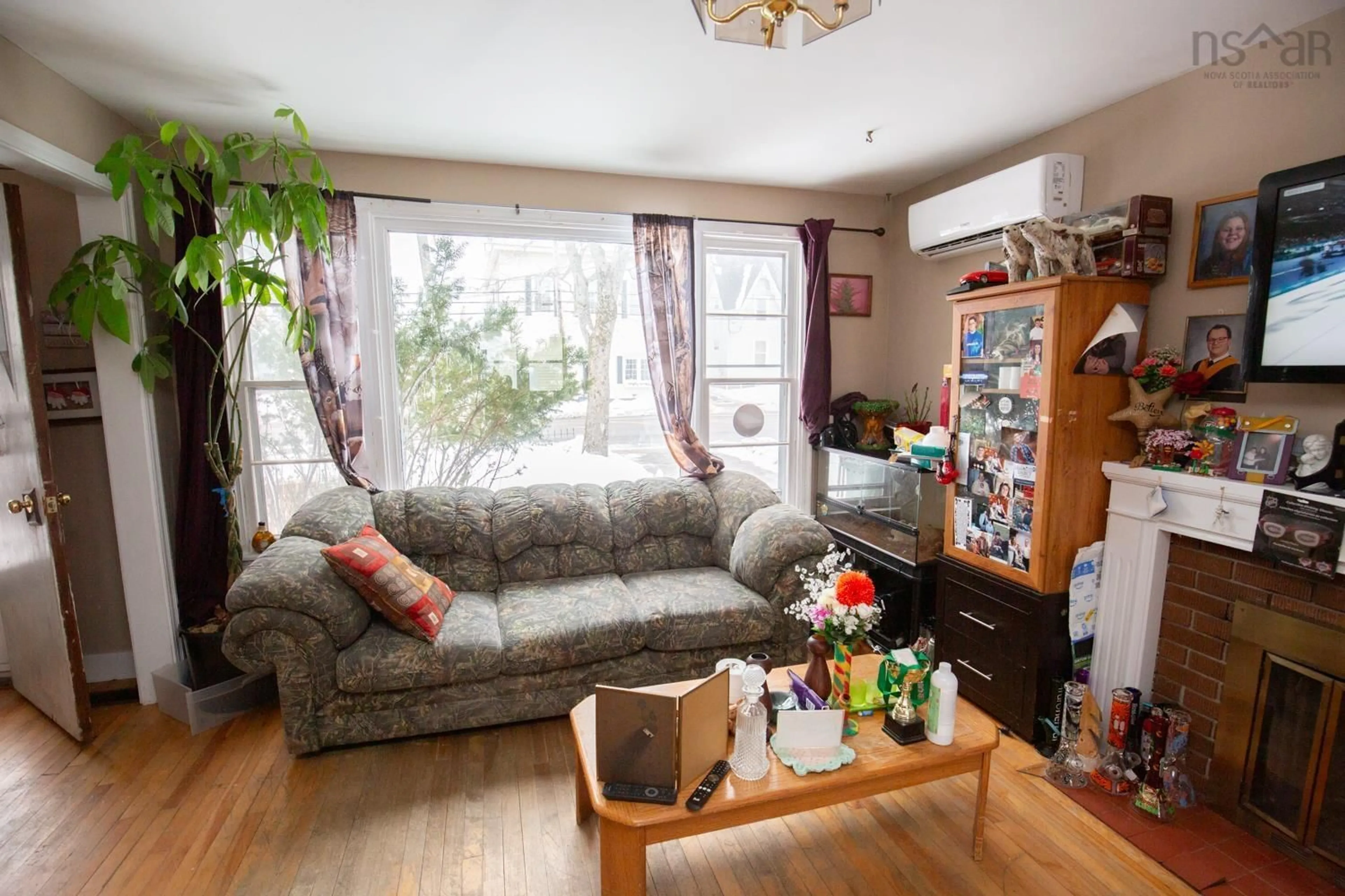 Living room with furniture, wood/laminate floor for 37 Queen St, Truro Nova Scotia B2N 2A9