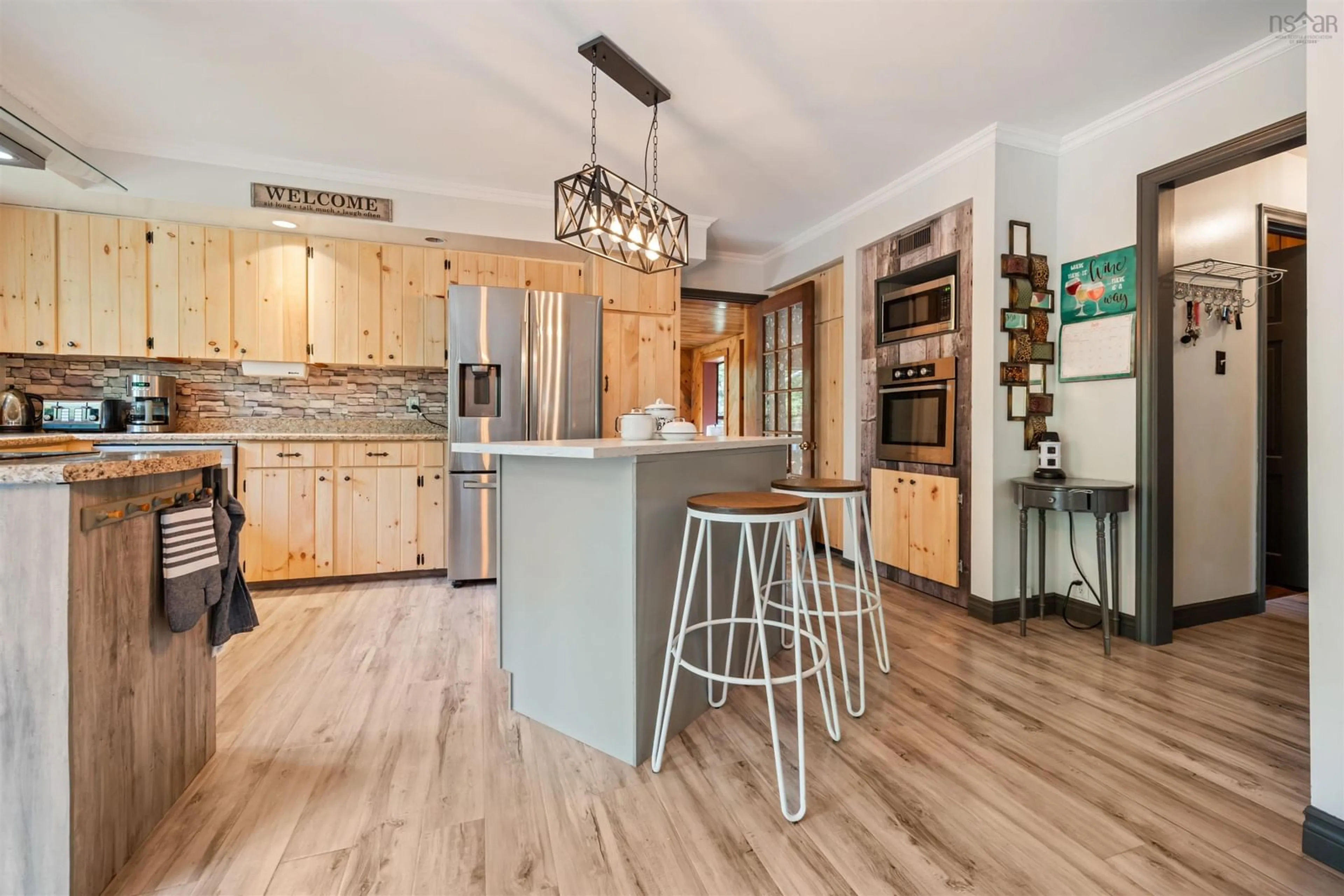 Open concept kitchen, wood/laminate floor for 275 Harris Rd, Haliburton Nova Scotia B0K 1H0