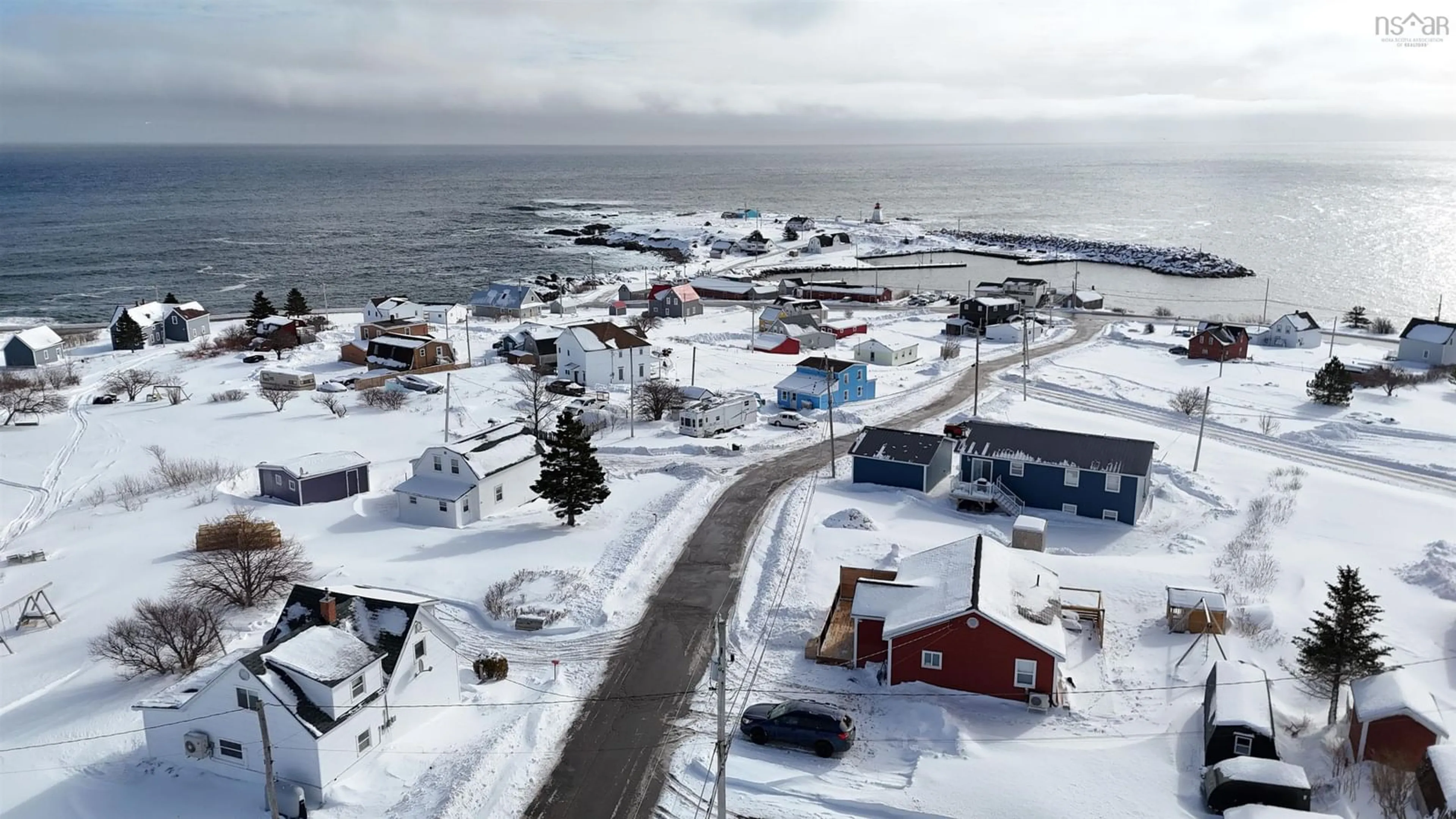 A pic from outside/outdoor area/front of a property/back of a property/a pic from drone, street for 35 Ocean View, Neils Harbour Nova Scotia B0C 1N0
