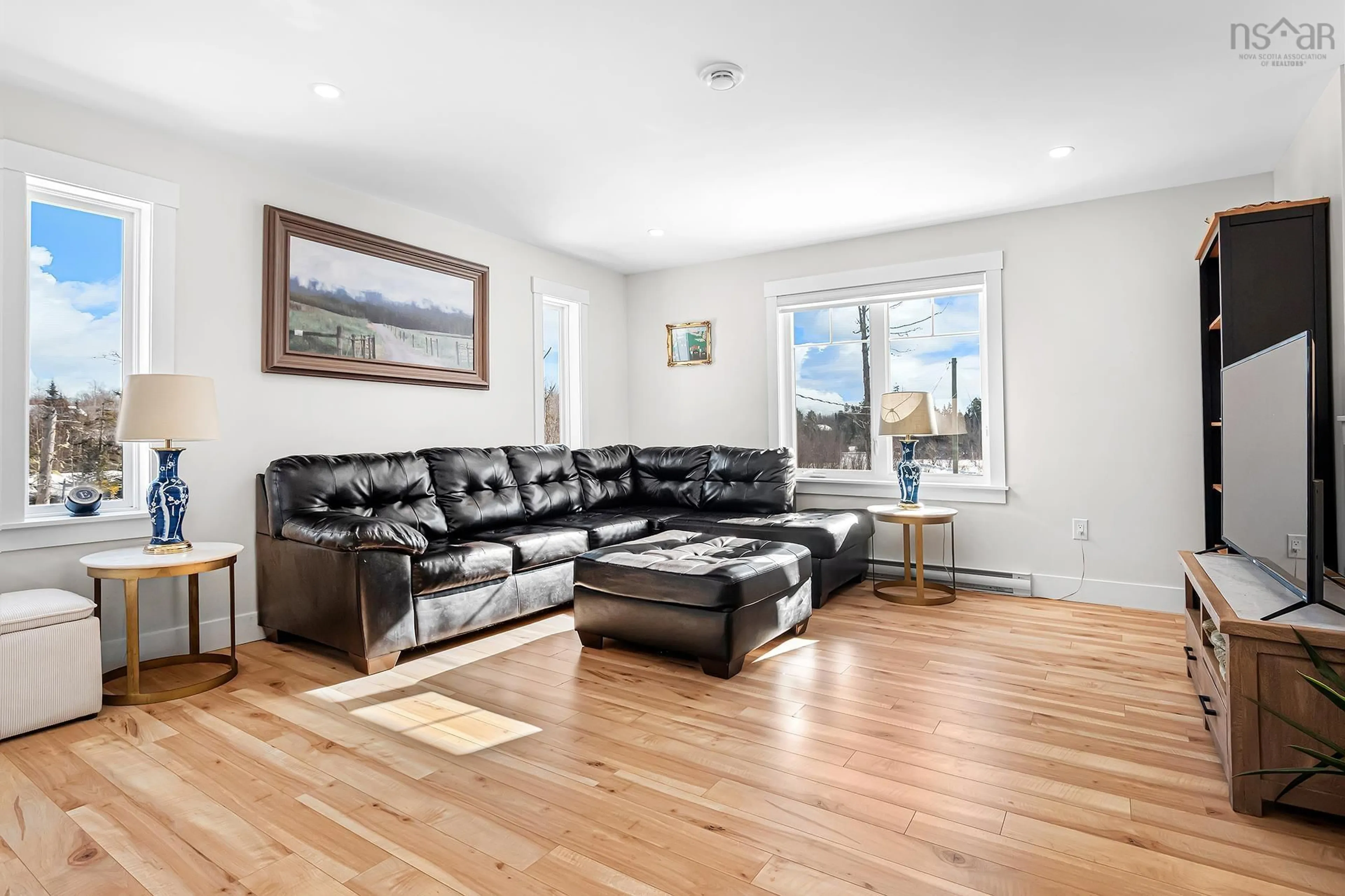 Living room with furniture, wood/laminate floor for 212 Norman Blvd, Hammonds Plains Nova Scotia B4B 1W3