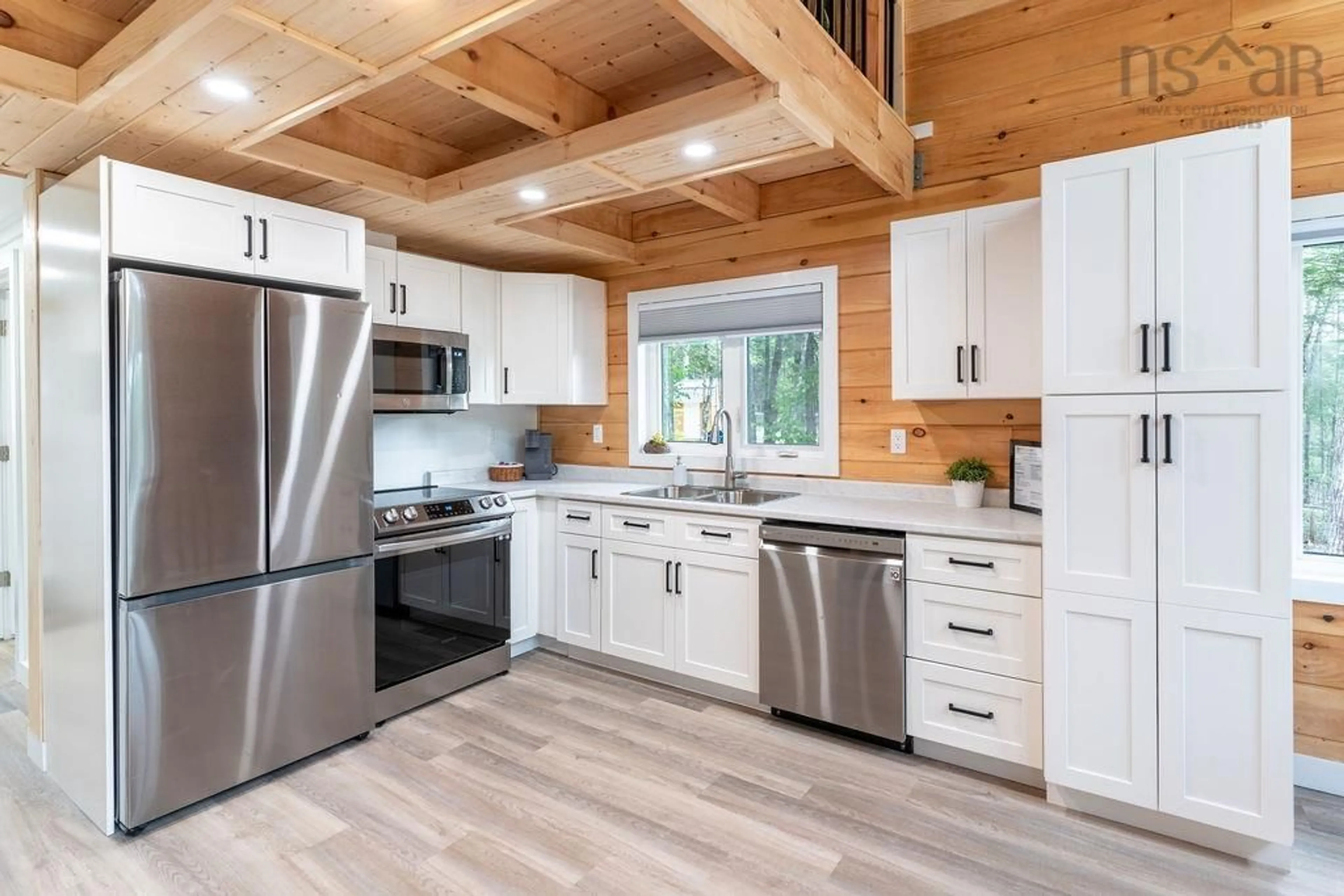 Open concept kitchen, wood/laminate floor for 21 Phoenix Lane, Vaughan Nova Scotia B0N 2T0