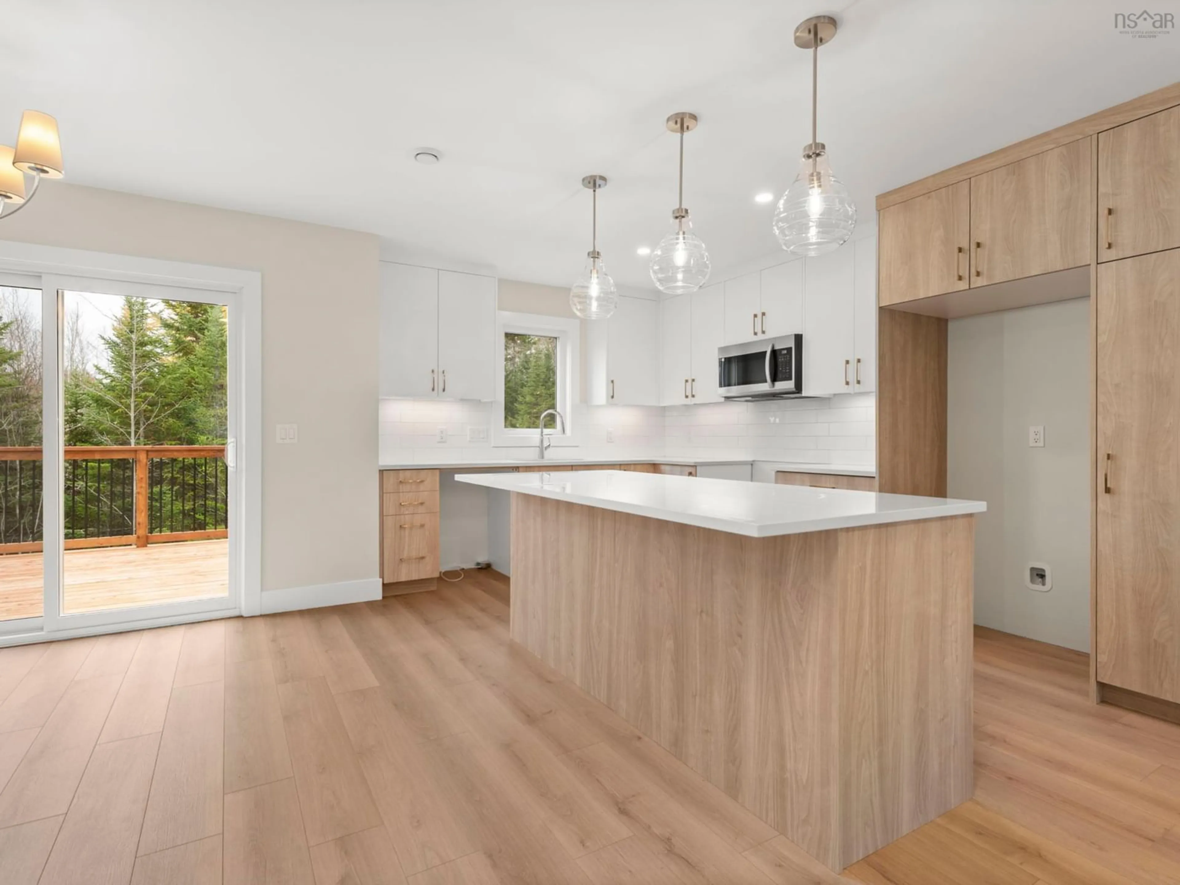 Open concept kitchen, wood/laminate floor for 41 Lew Cres #L038A, Lantz Nova Scotia B2S 2A5