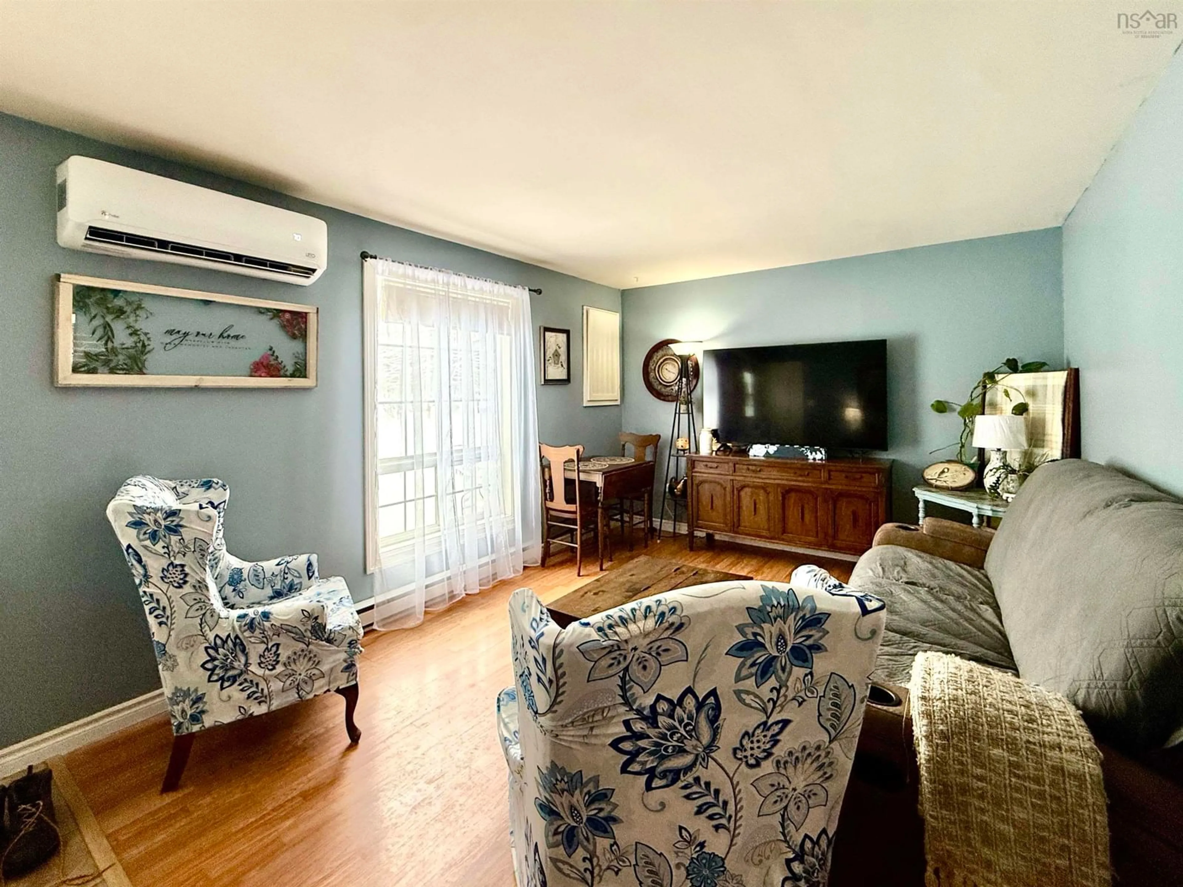 Living room with furniture, wood/laminate floor for 47 & 49 Geiger Dr, Wilmot Nova Scotia B0P 1R0