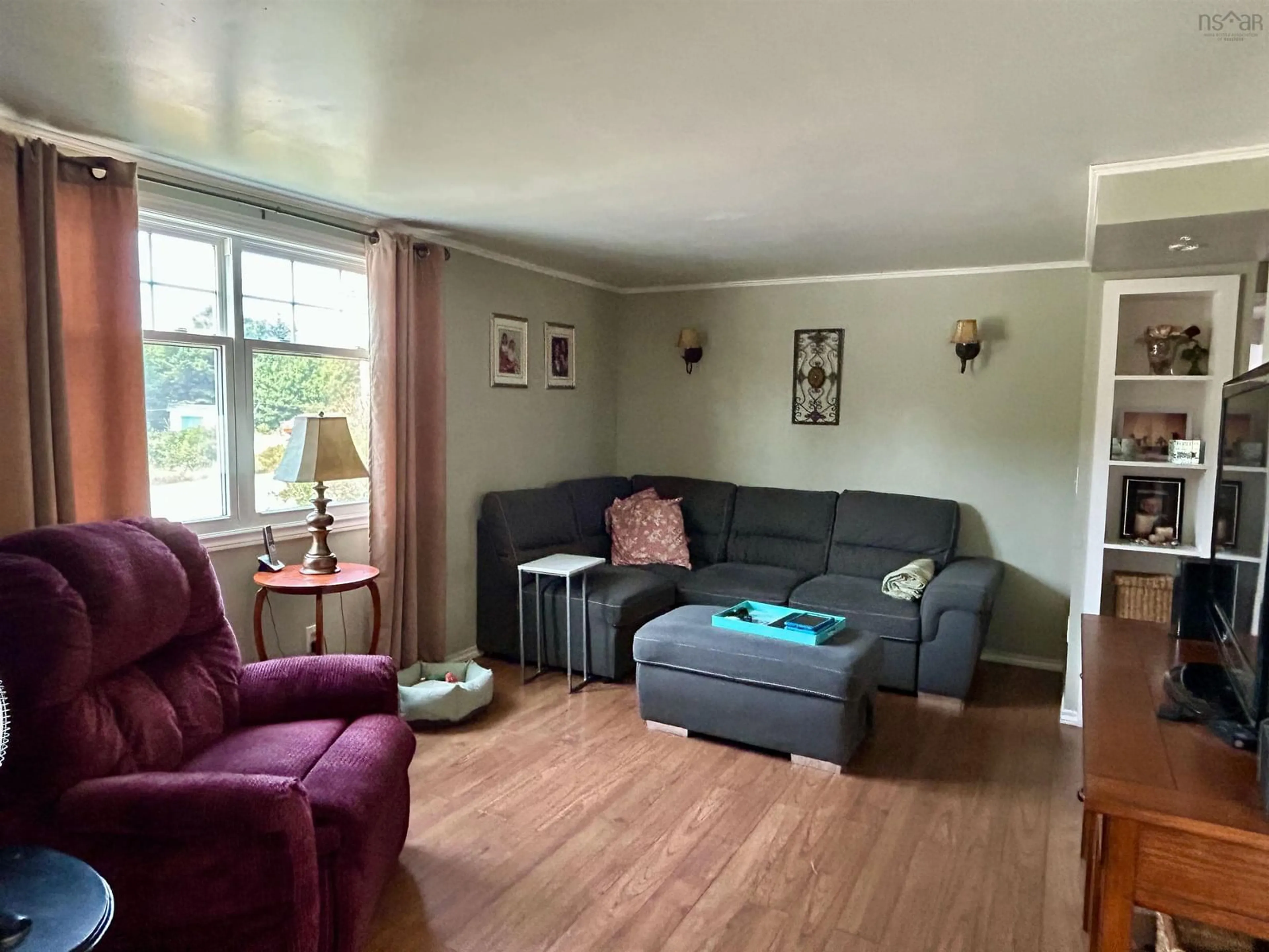 Living room with furniture, wood/laminate floor for 55 Newell Rd, Plymouth Nova Scotia B0W 1B0