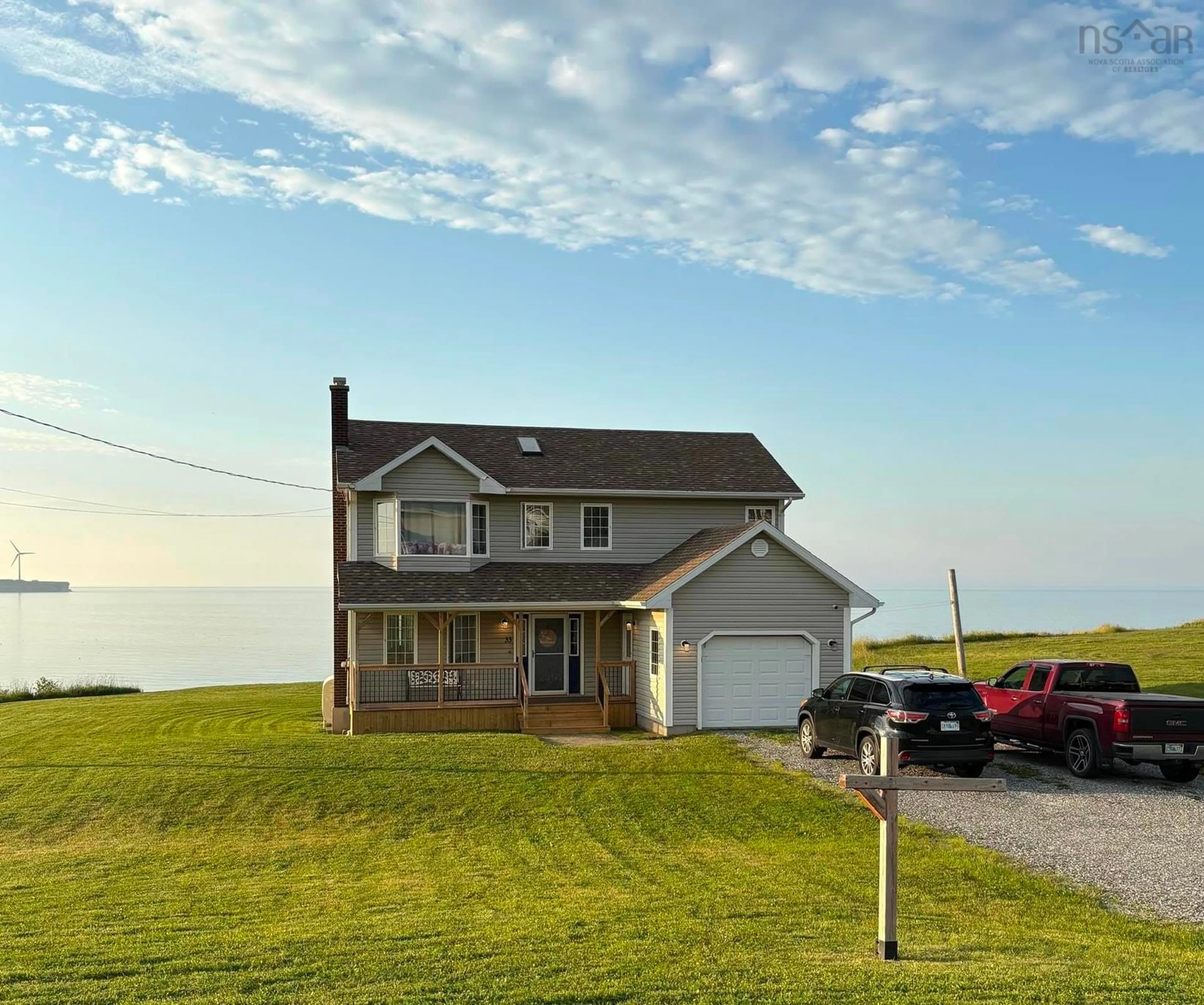 A pic from outside/outdoor area/front of a property/back of a property/a pic from drone, water/lake/river/ocean view for 33 Turnbull St, Dominion Nova Scotia B1G 1W5