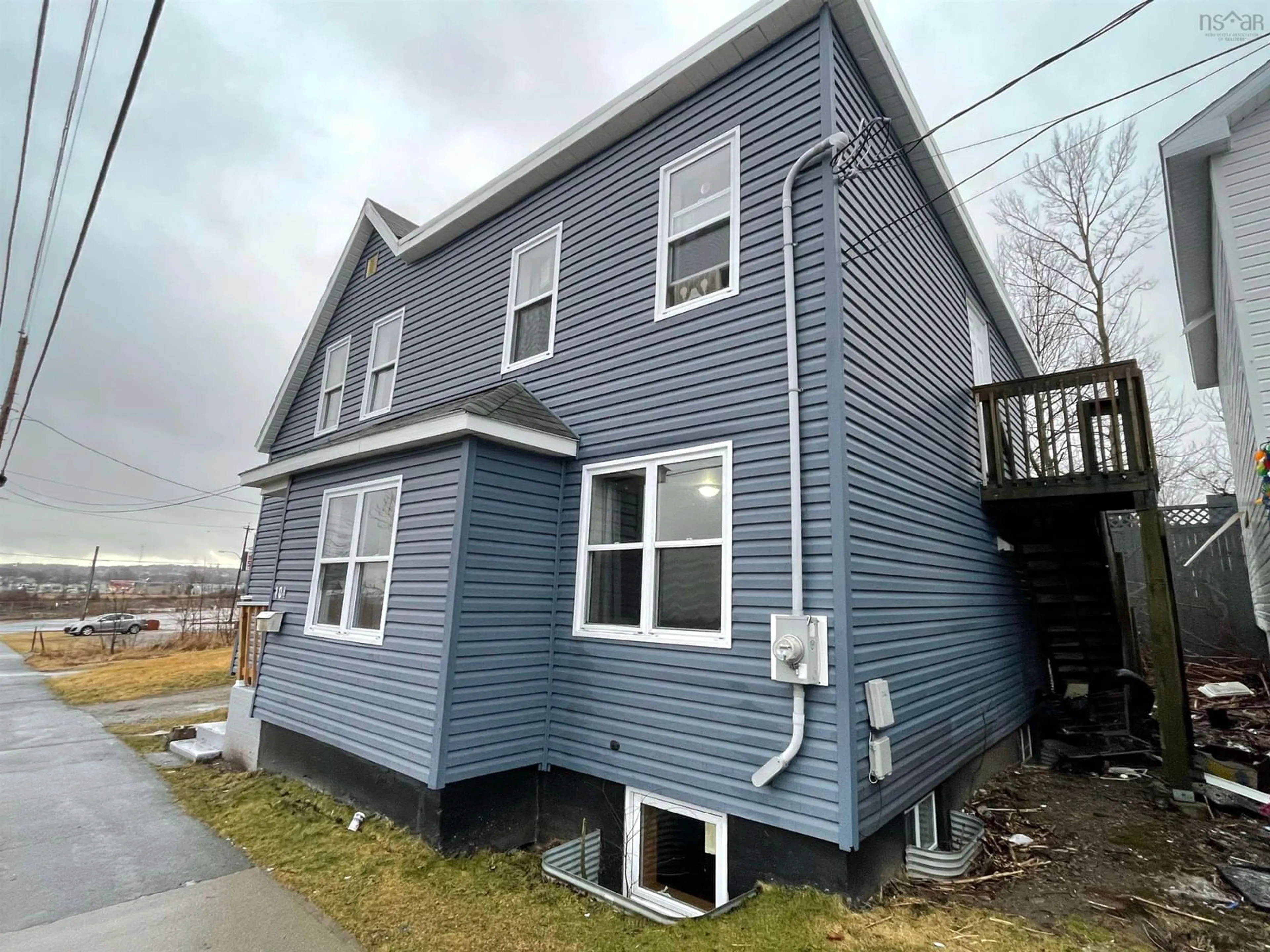 Home with vinyl exterior material, building for 104 Intercolonial St, Sydney Nova Scotia B1P 1S6