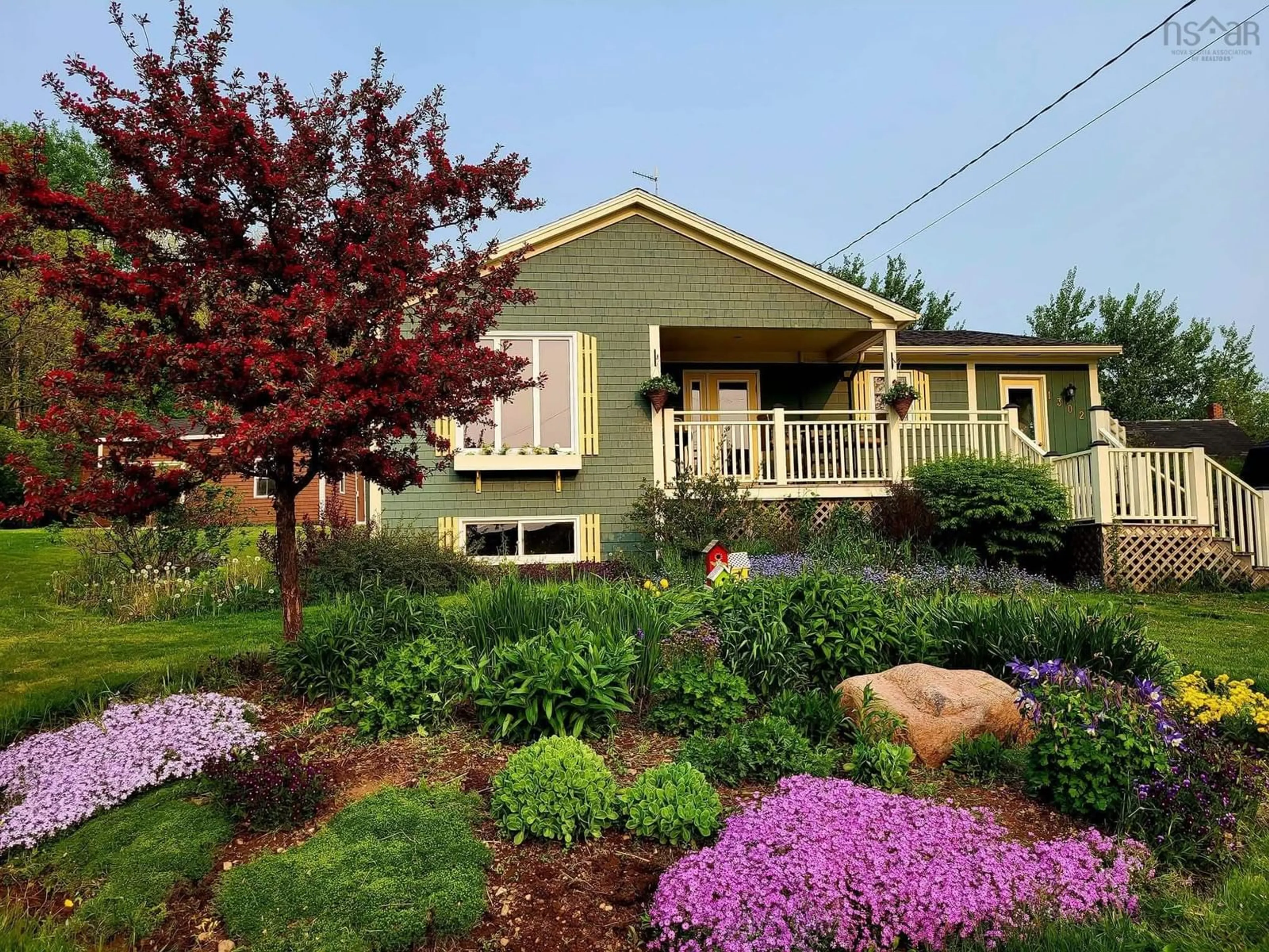 Home with vinyl exterior material, street for 1302 Macgarry Rd, Grand Étang Nova Scotia B0E 1H0