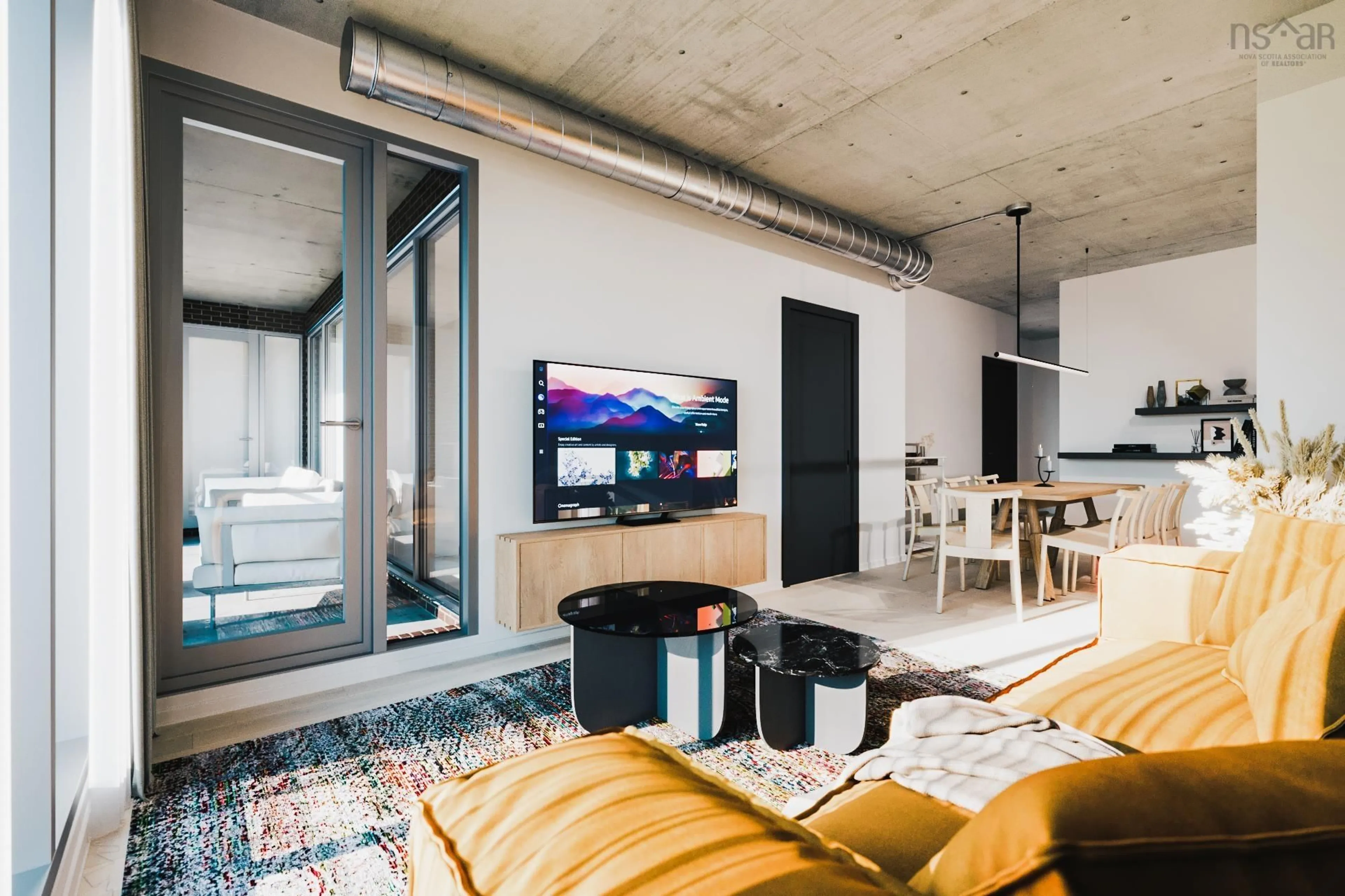 Living room with furniture, cement floor for 2250 Maitland St #211, Halifax Nova Scotia B3K 2Z9