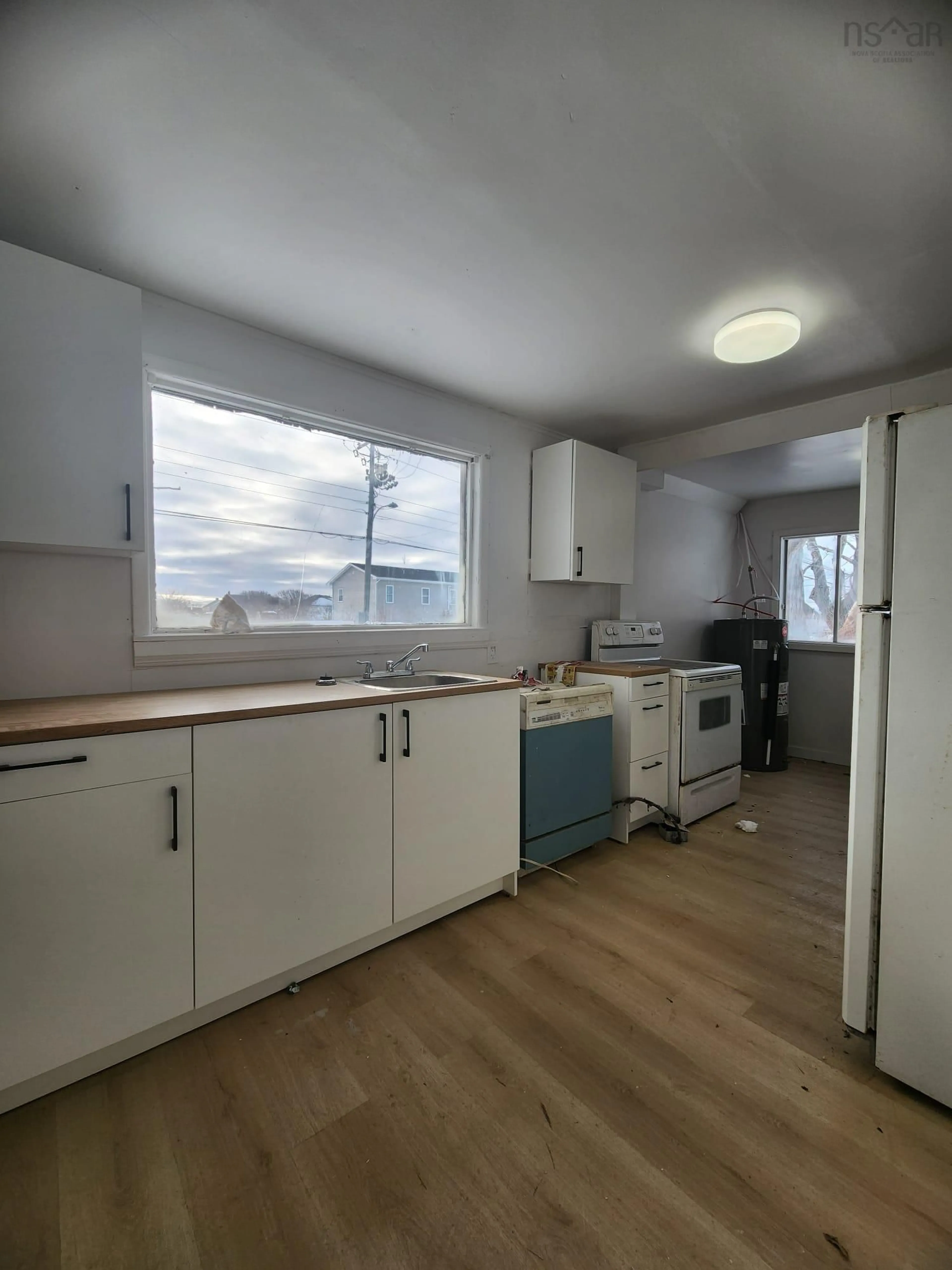 Standard kitchen, wood/laminate floor for 23 Sixth St, Glace Bay Nova Scotia B1A 4J8