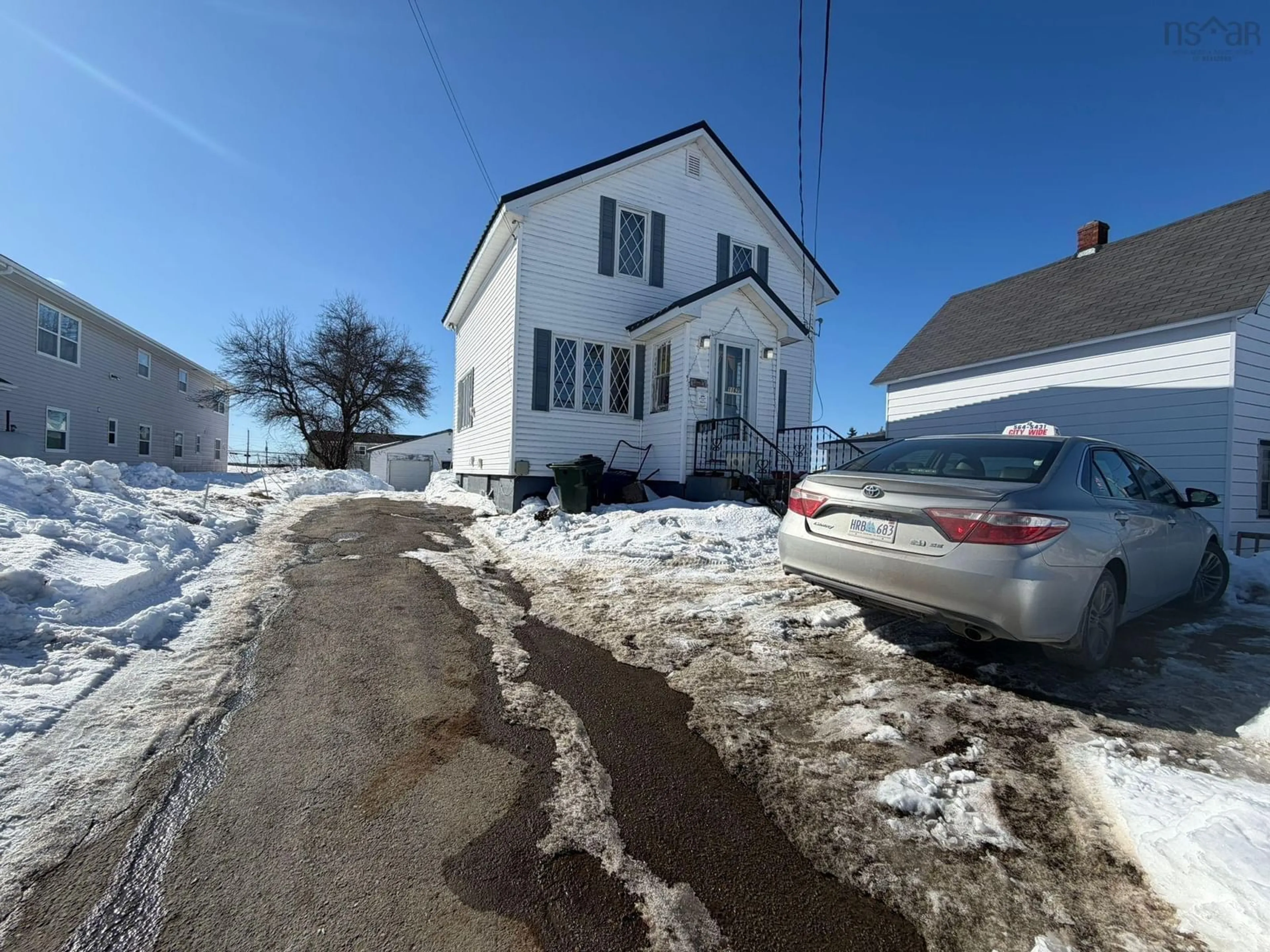 A pic from outside/outdoor area/front of a property/back of a property/a pic from drone, street for 1162 George St, Sydney Nova Scotia B1P 1N2