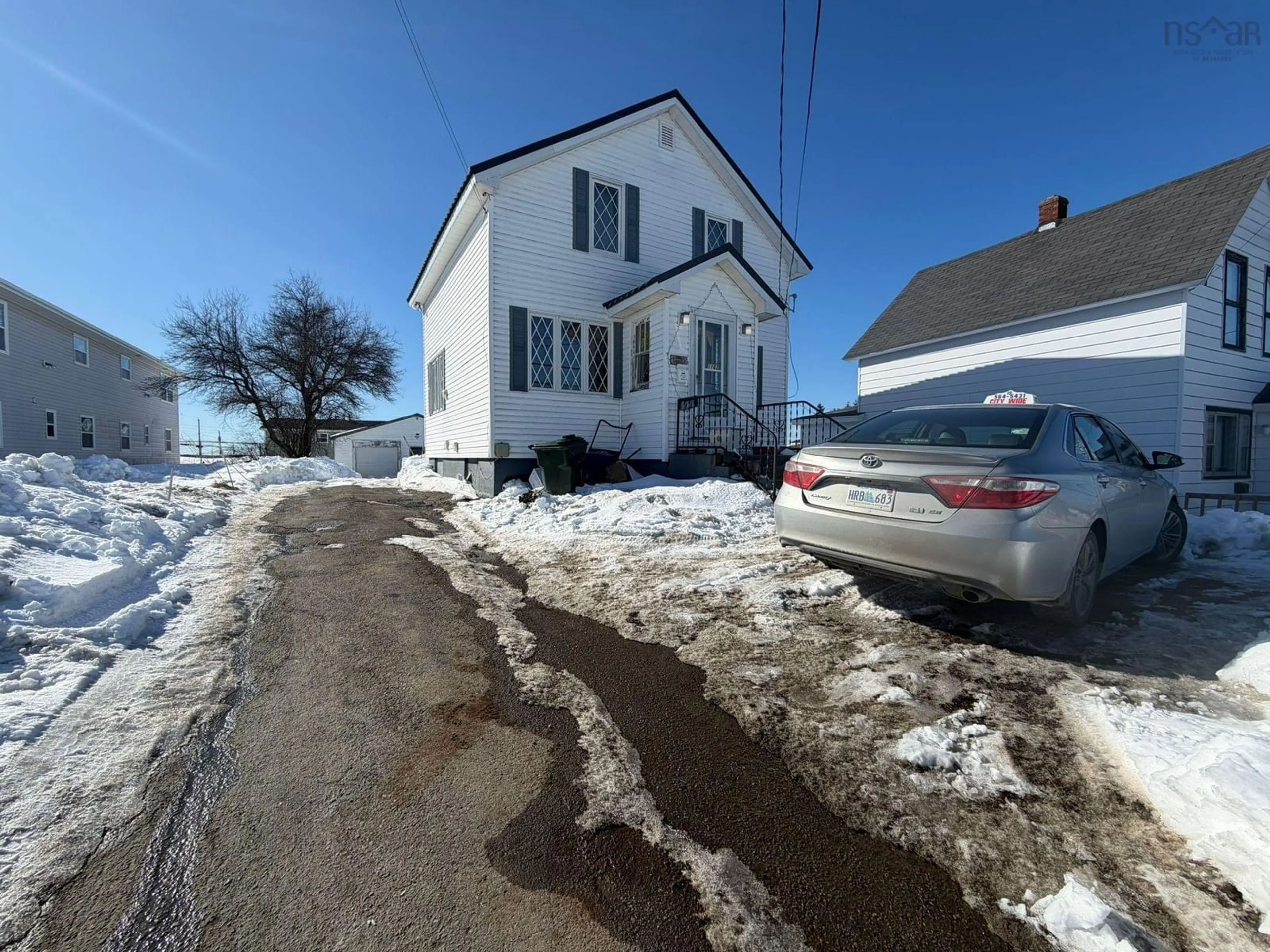 A pic from outside/outdoor area/front of a property/back of a property/a pic from drone, street for 1162 George St, Sydney Nova Scotia B1P 1N2