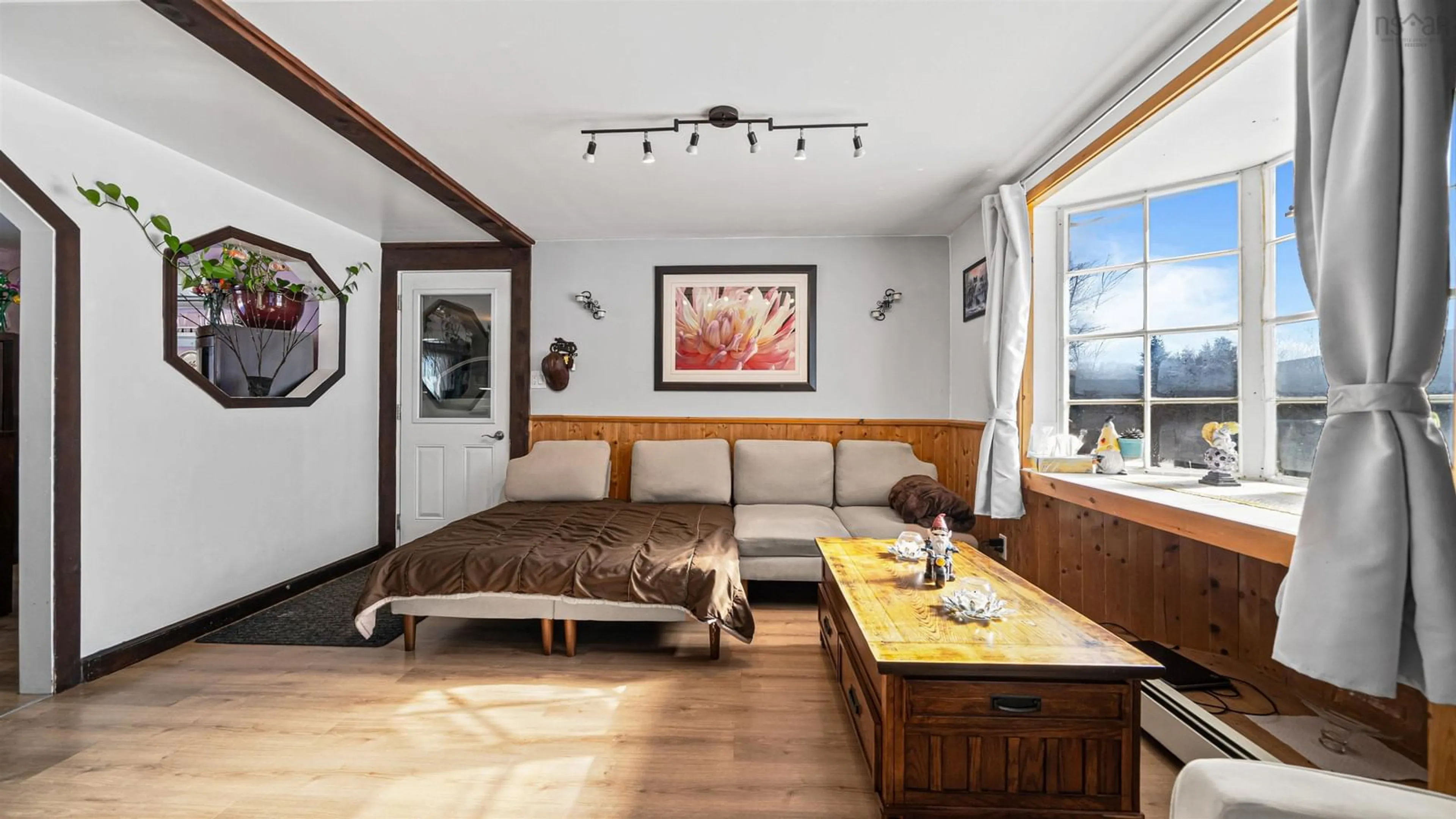 Living room with furniture, wood/laminate floor for 114 Bog Rd, Berwick West Nova Scotia B0P 1E0