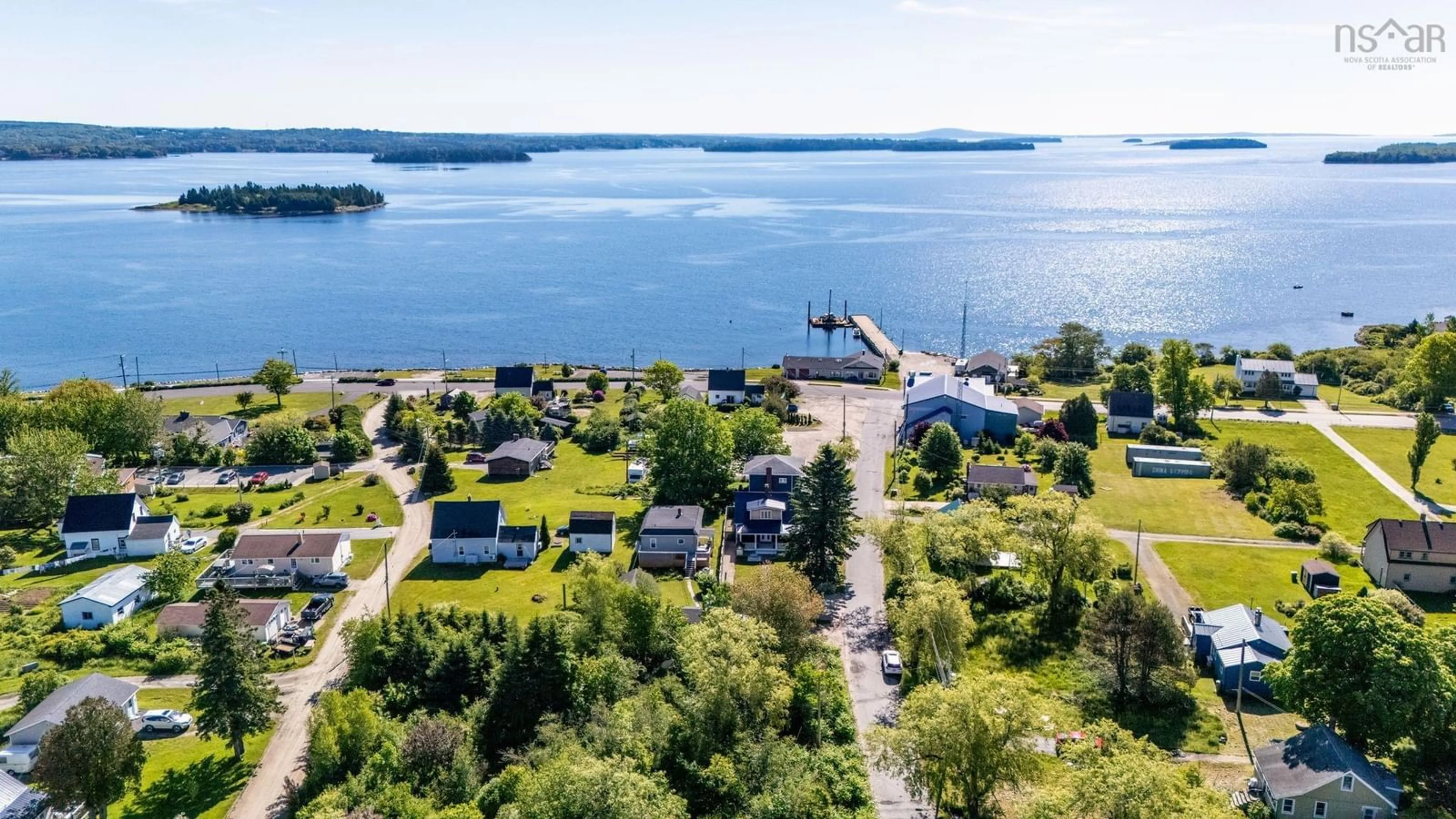 A pic from outside/outdoor area/front of a property/back of a property/a pic from drone, water/lake/river/ocean view for 24 Station Rd, Western Shore Nova Scotia B0J 3M0